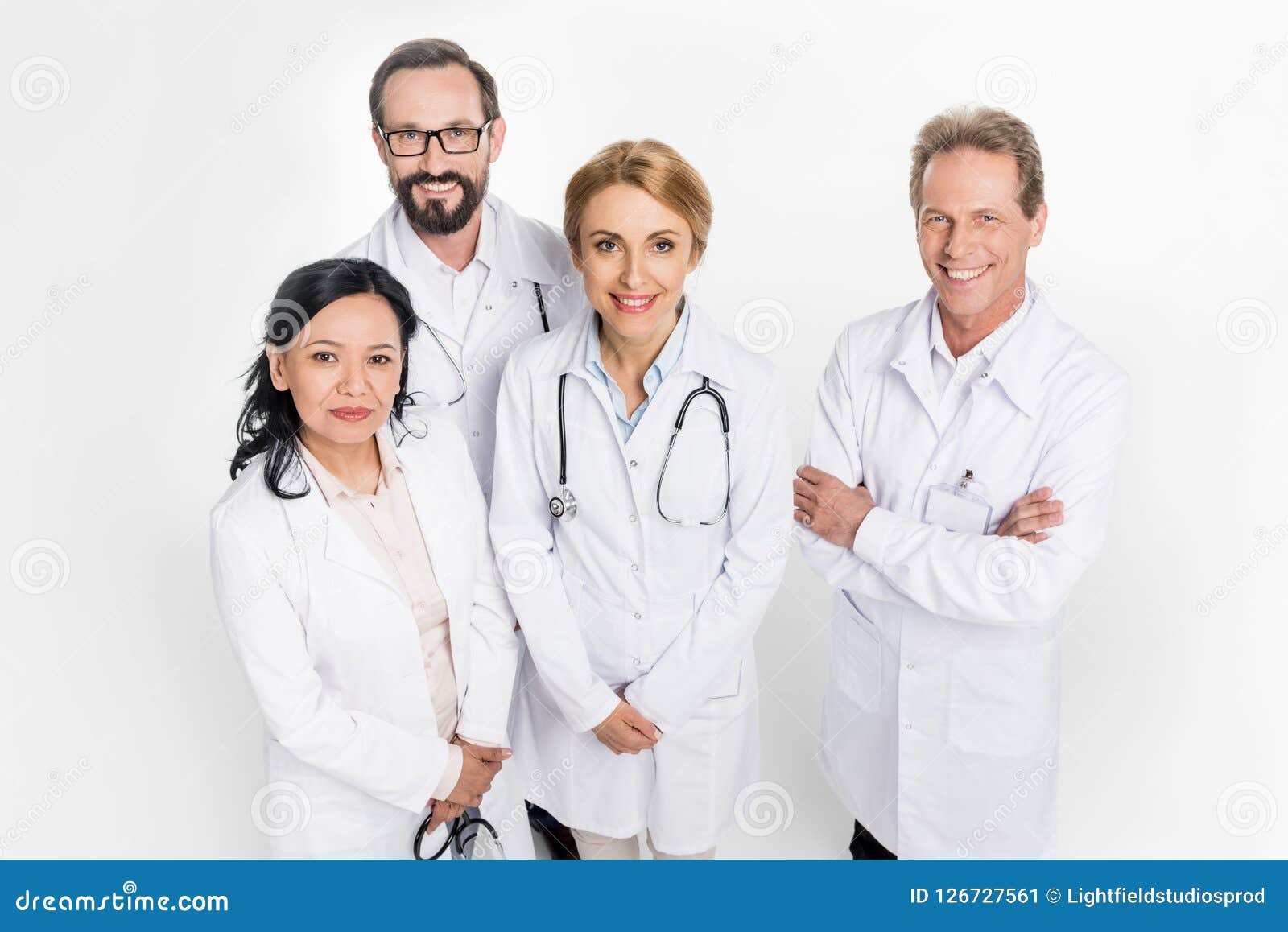 high angle view of professional team of doctors in white coats looking at camera