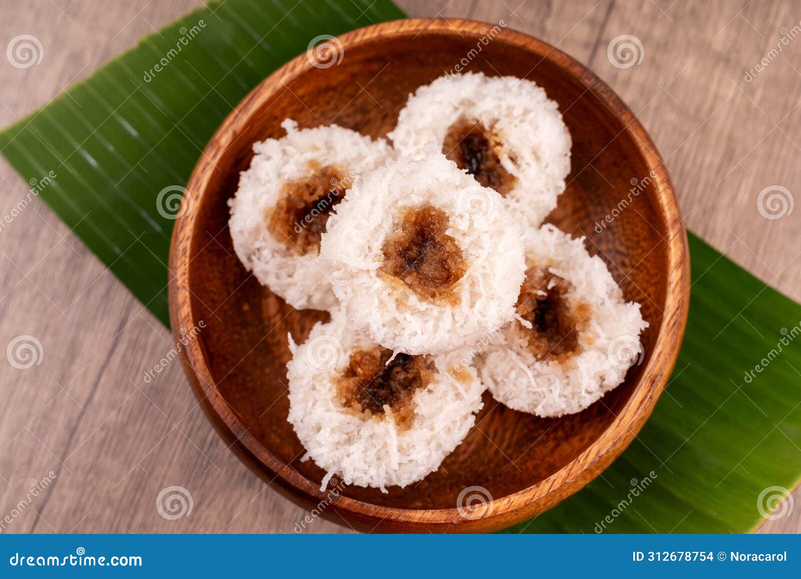 putu bambu or steamed rice flour cake with grated coconut and palm sugar filling