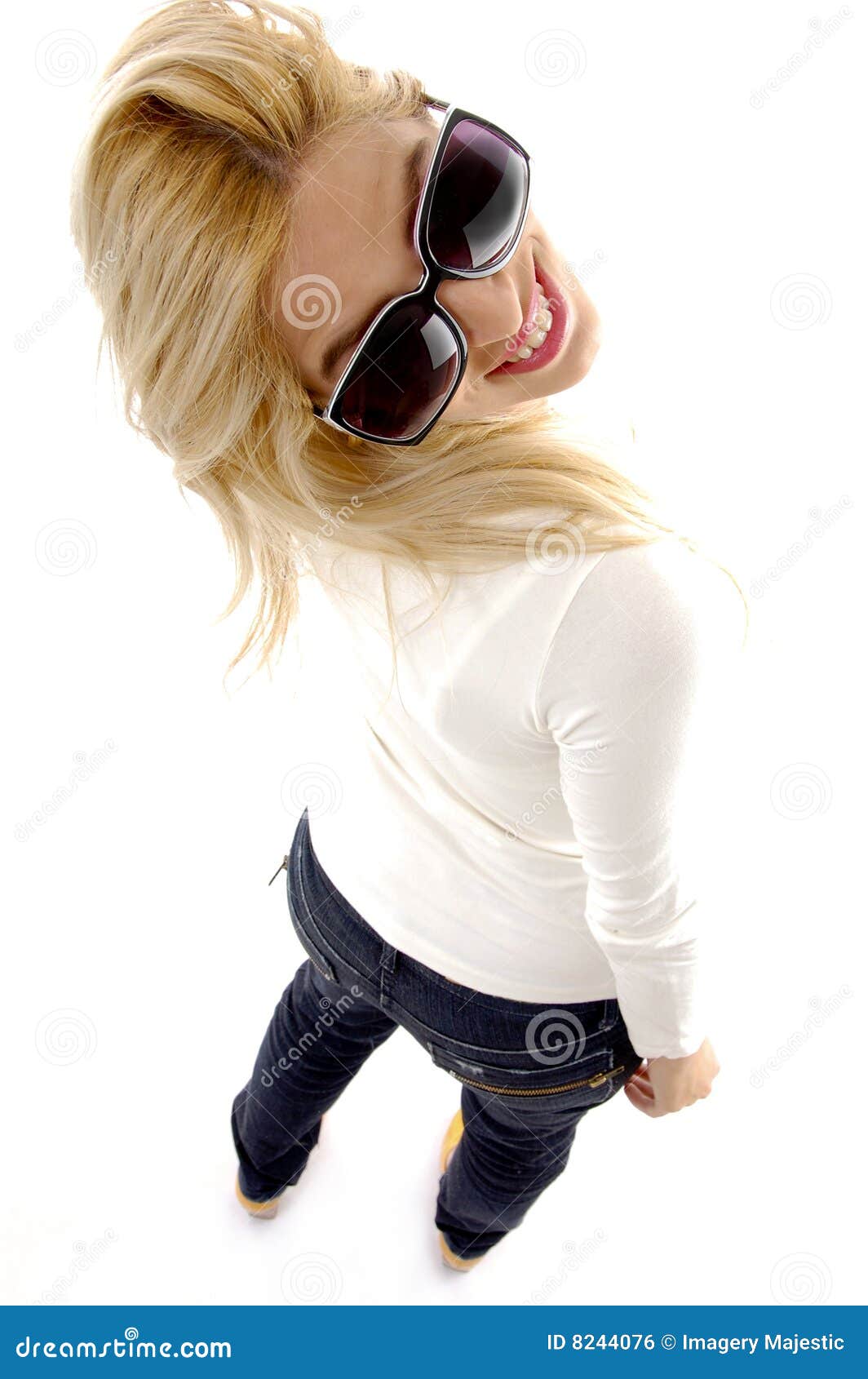 High angle view of smiling young female on an isolated background