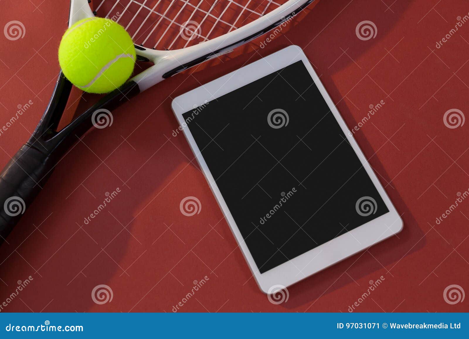 High Angle View of Tennis Racket and Ball by Digital Tablet Stock Image