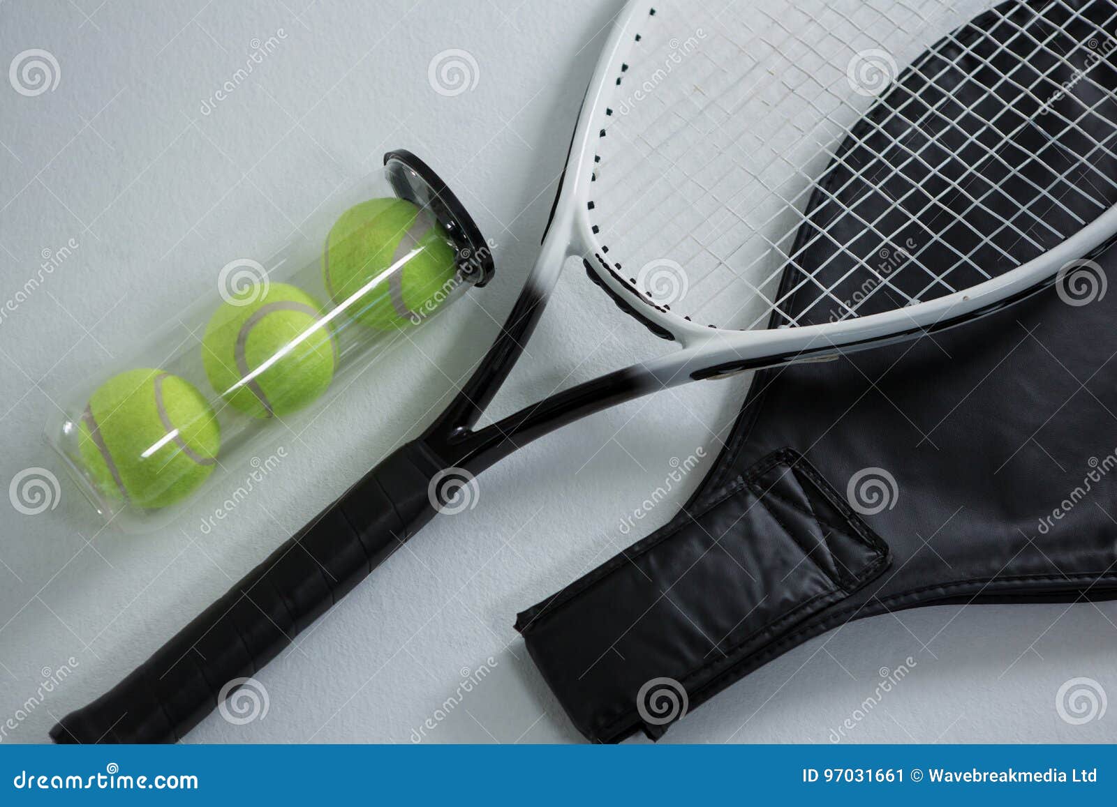High Angle View of Tennis Racket by Balls in Container Stock Image