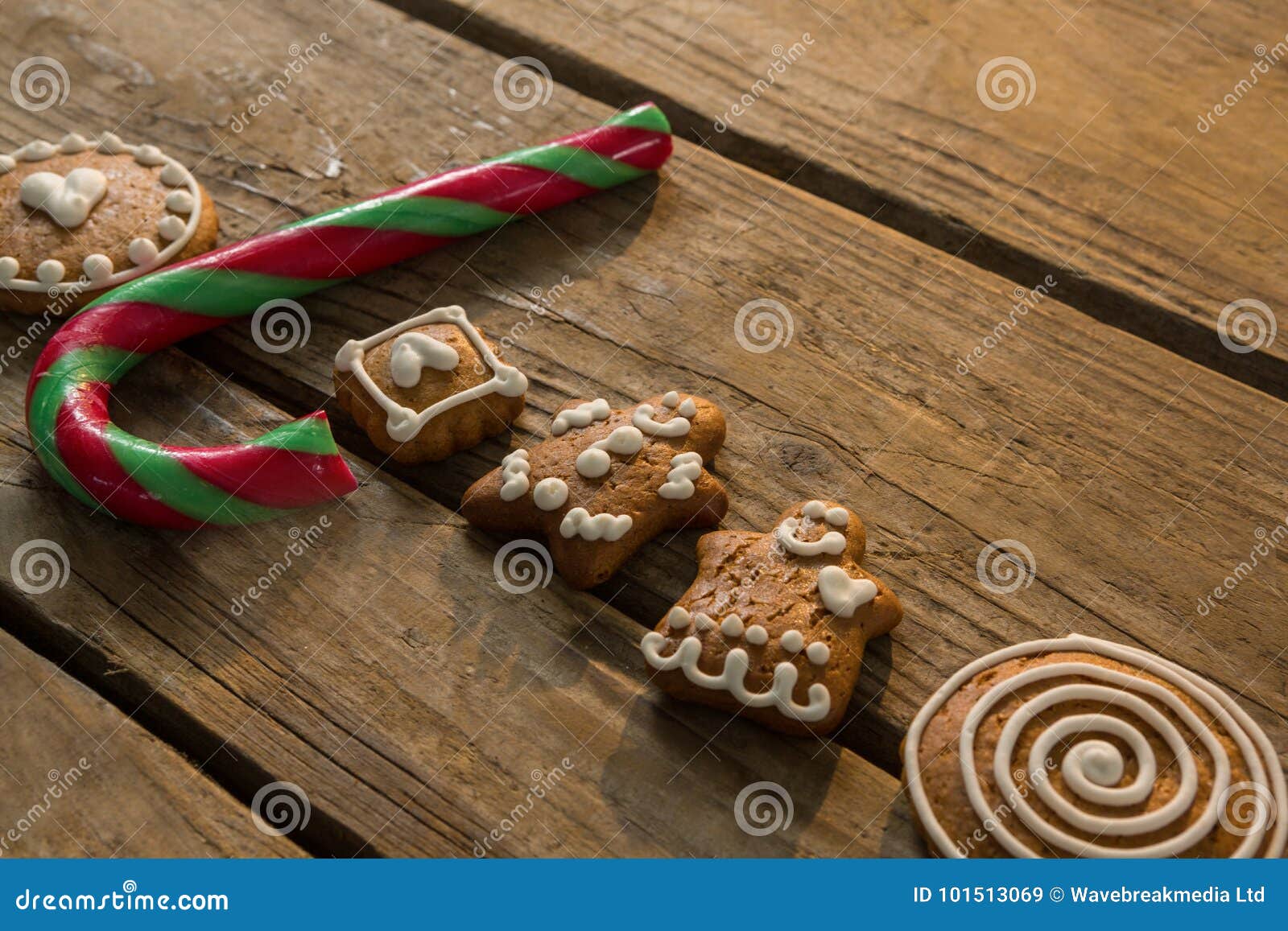 High Angle View View of Candy Cane with Gingerbread Cookies Arranged on
