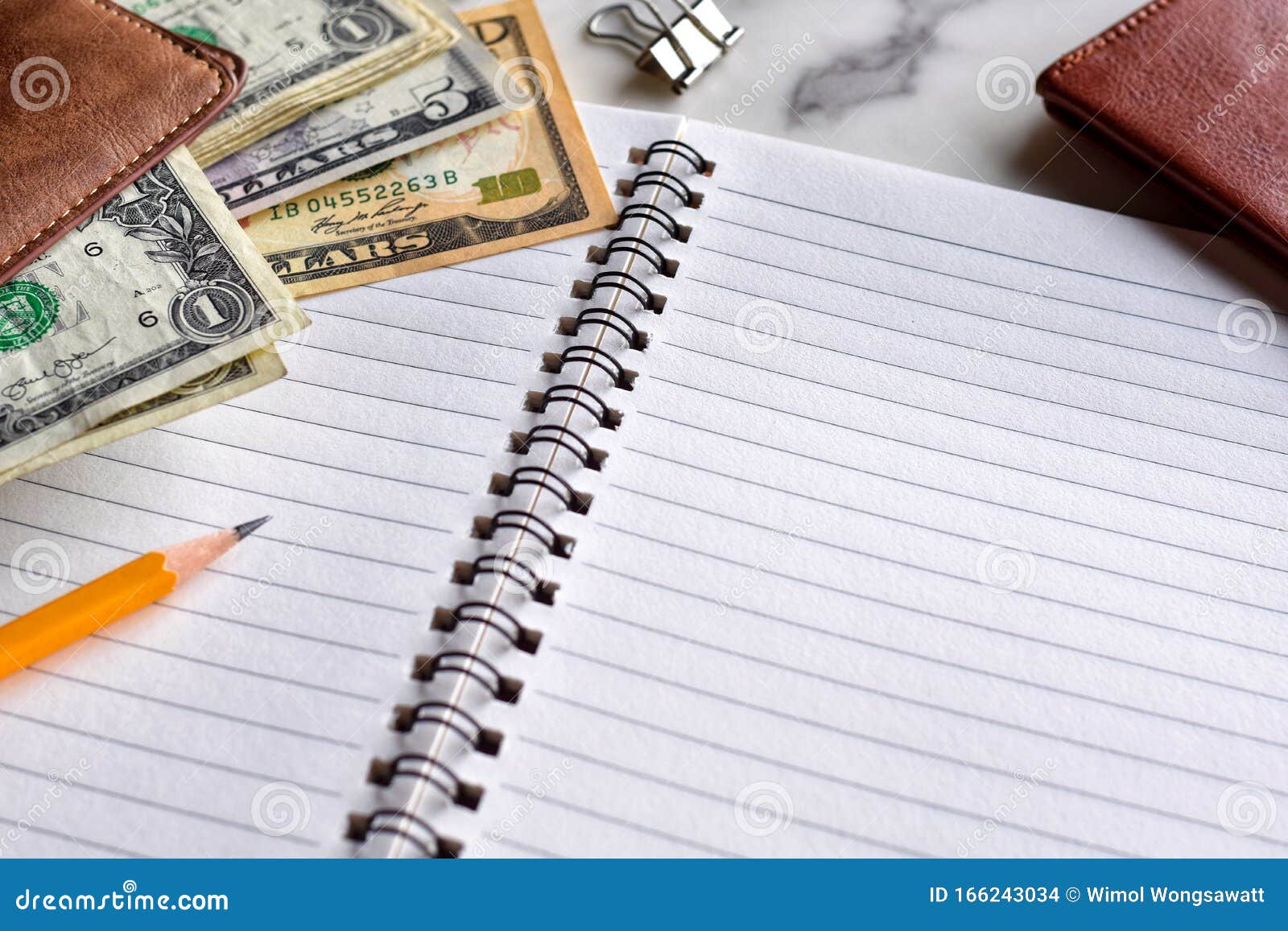 high angle view, writing notebook for earnings or expenses.