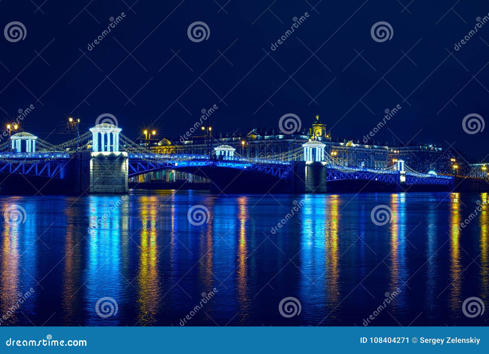 dvortsoviy bridge in blue lights at christmas night with river neva free of ice