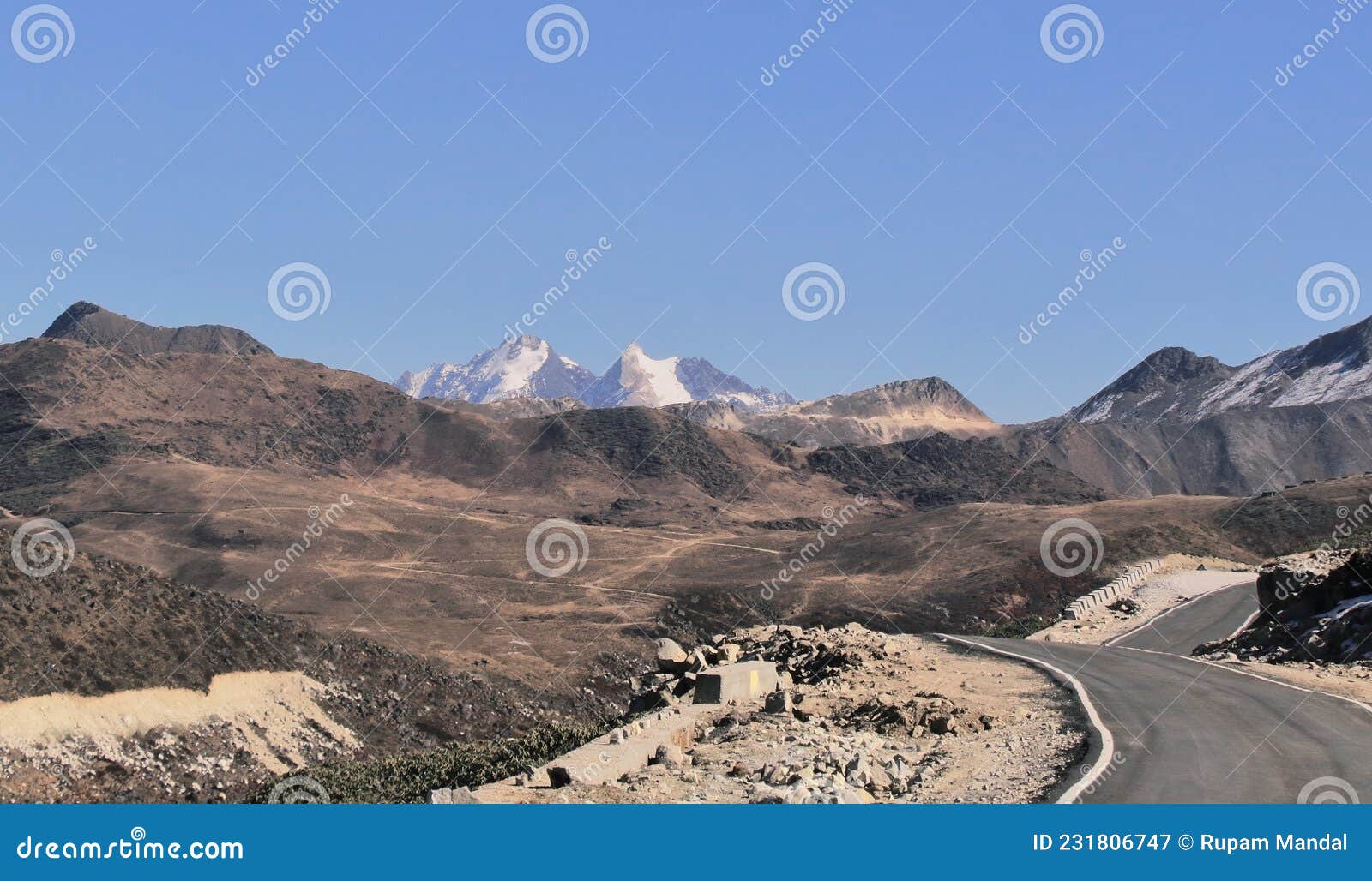 high himalayan road and snowcapped peak near bum la pass