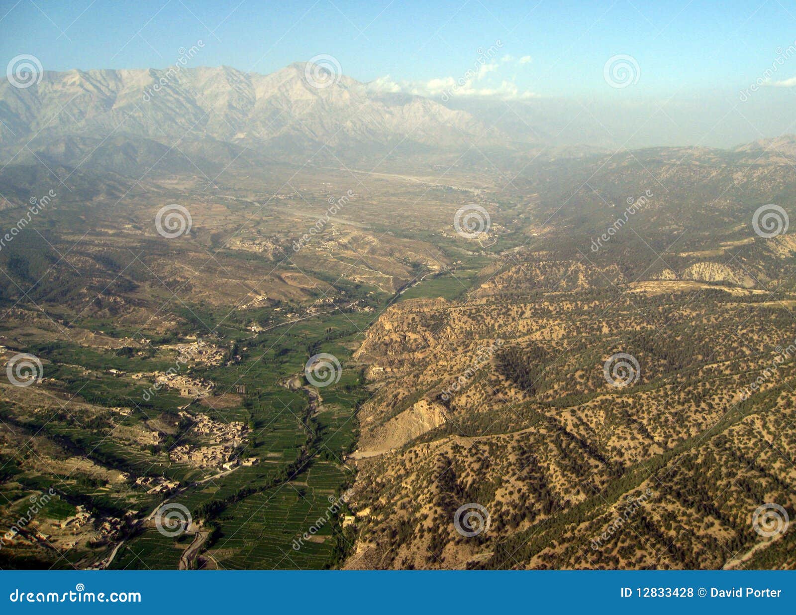 high peaks rise above the haze near pakistan