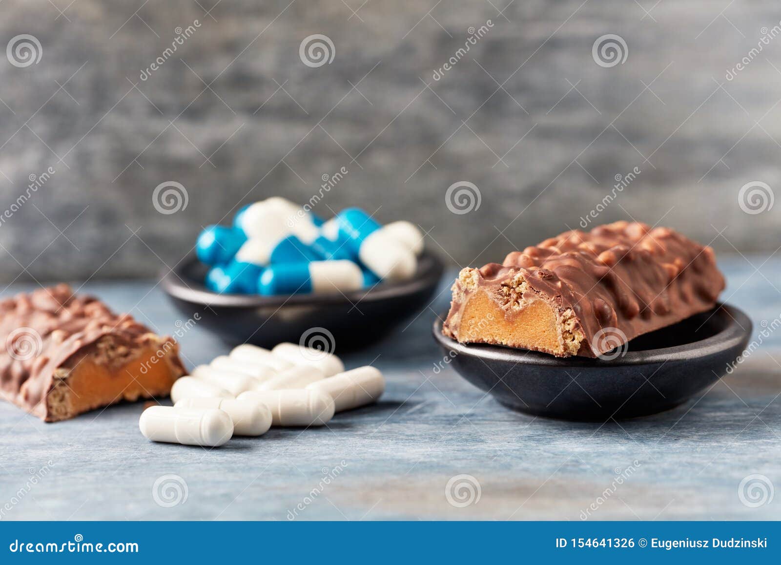 high protein bar, tri-creatine malate and beta-alanine capsules.