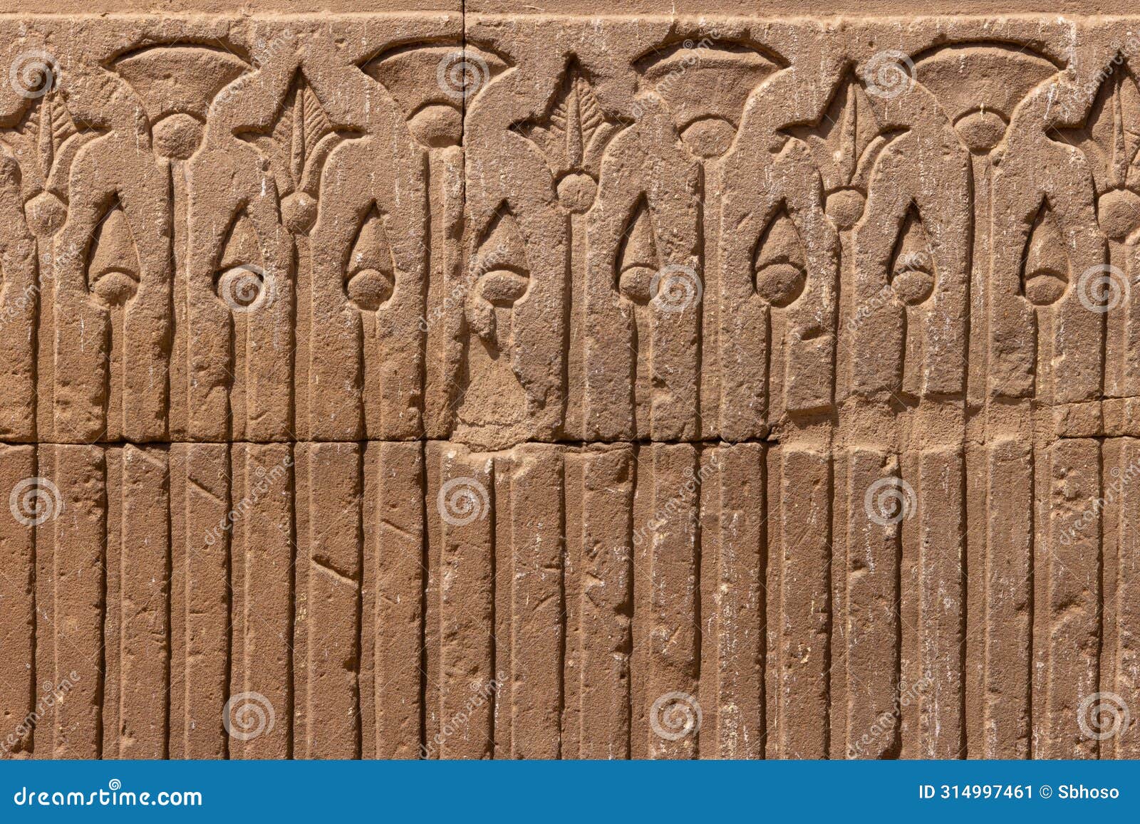 high res ancient pale red limestone egyptian tomb ceiling with detailed symmetrical relief with spears and flowers