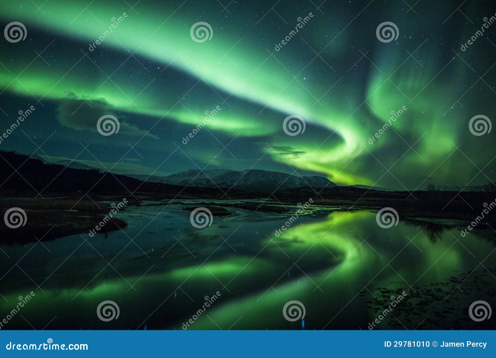 northern lights above a lagoon in iceland