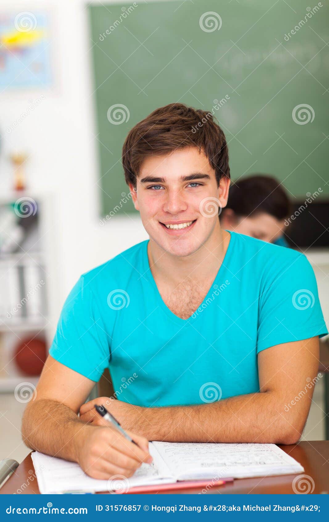 high school boy handsome writing class work 31576857