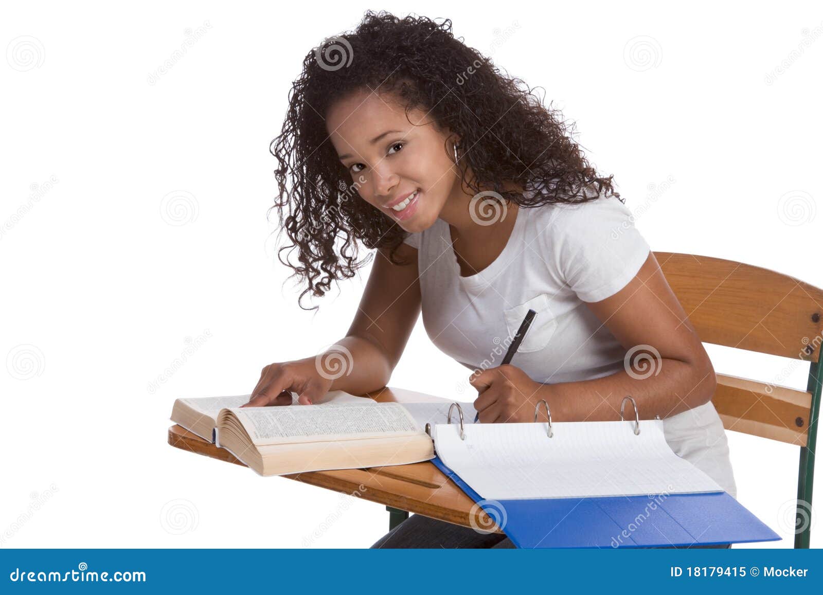 High School Schoolgirl Student By Desk Studying Stock Image