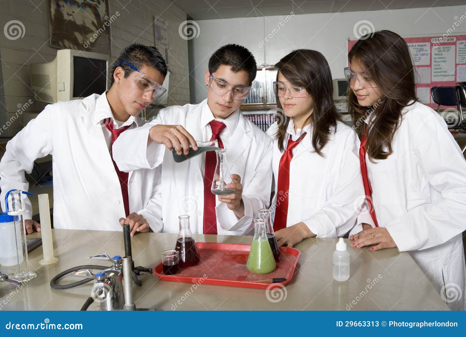 high school students conducting science experiment