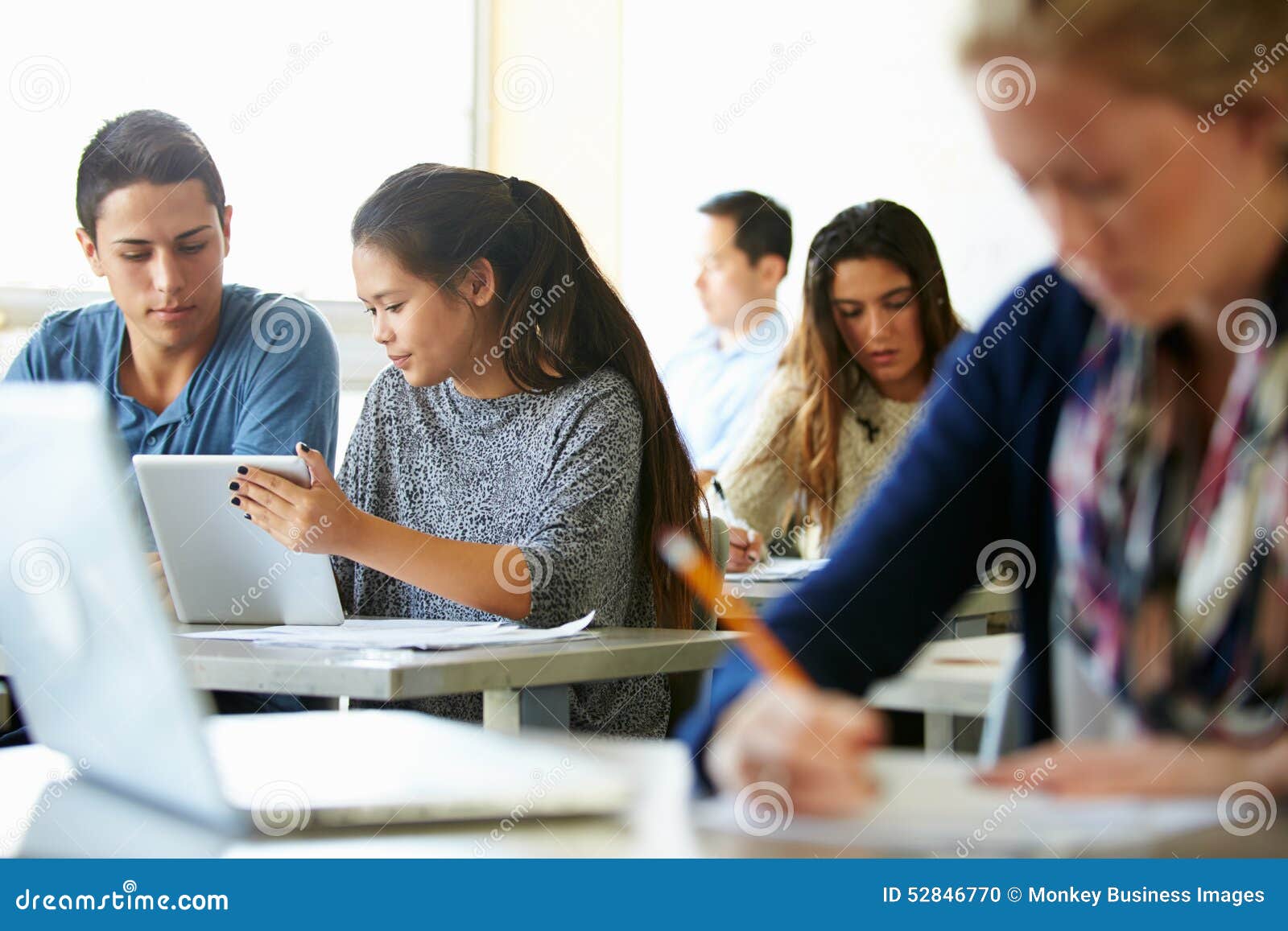 High School Students with Laptops and Digital Tablets Stock Photo