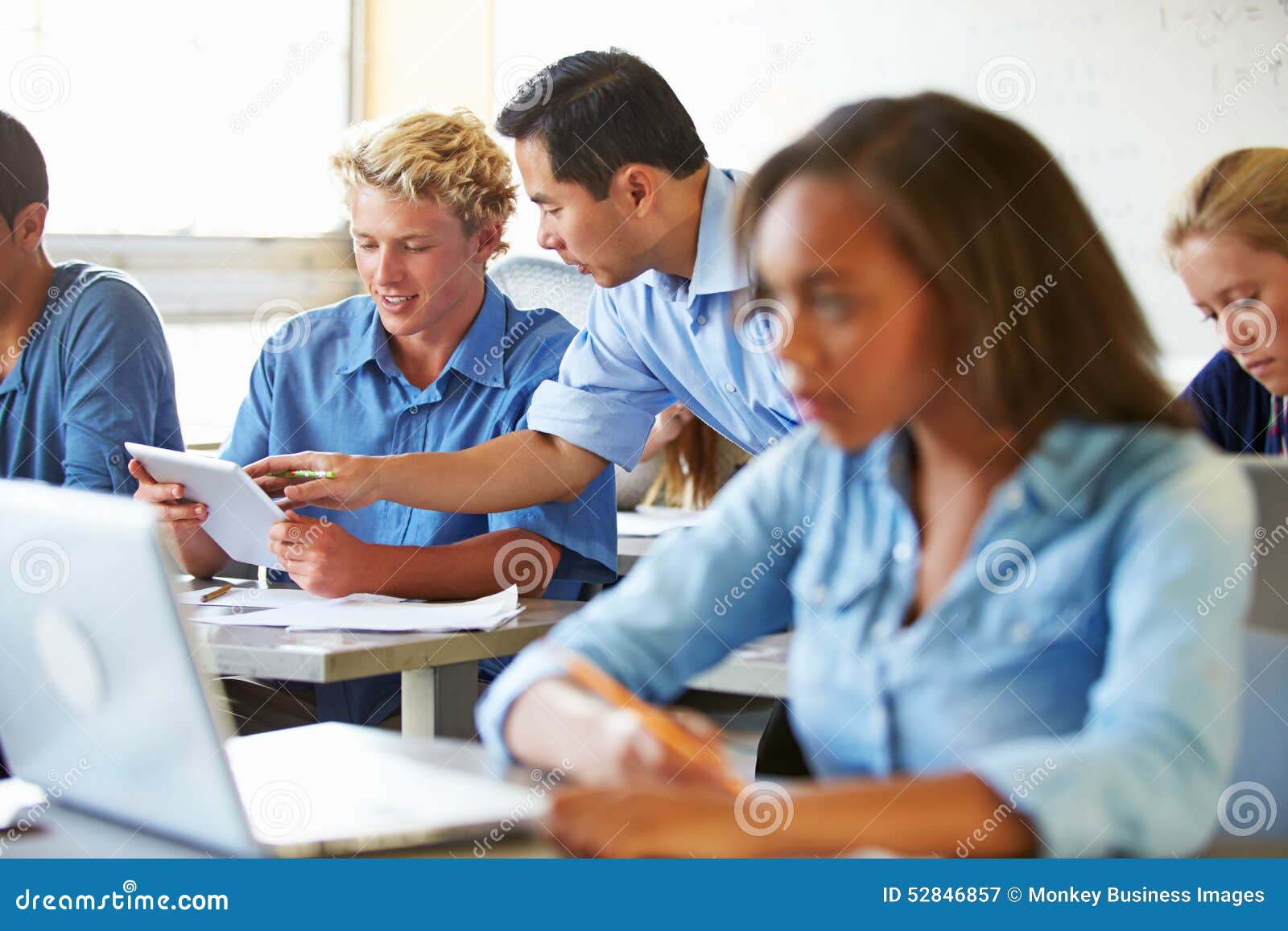High School Students with Laptops and Digital Tablets Stock Image