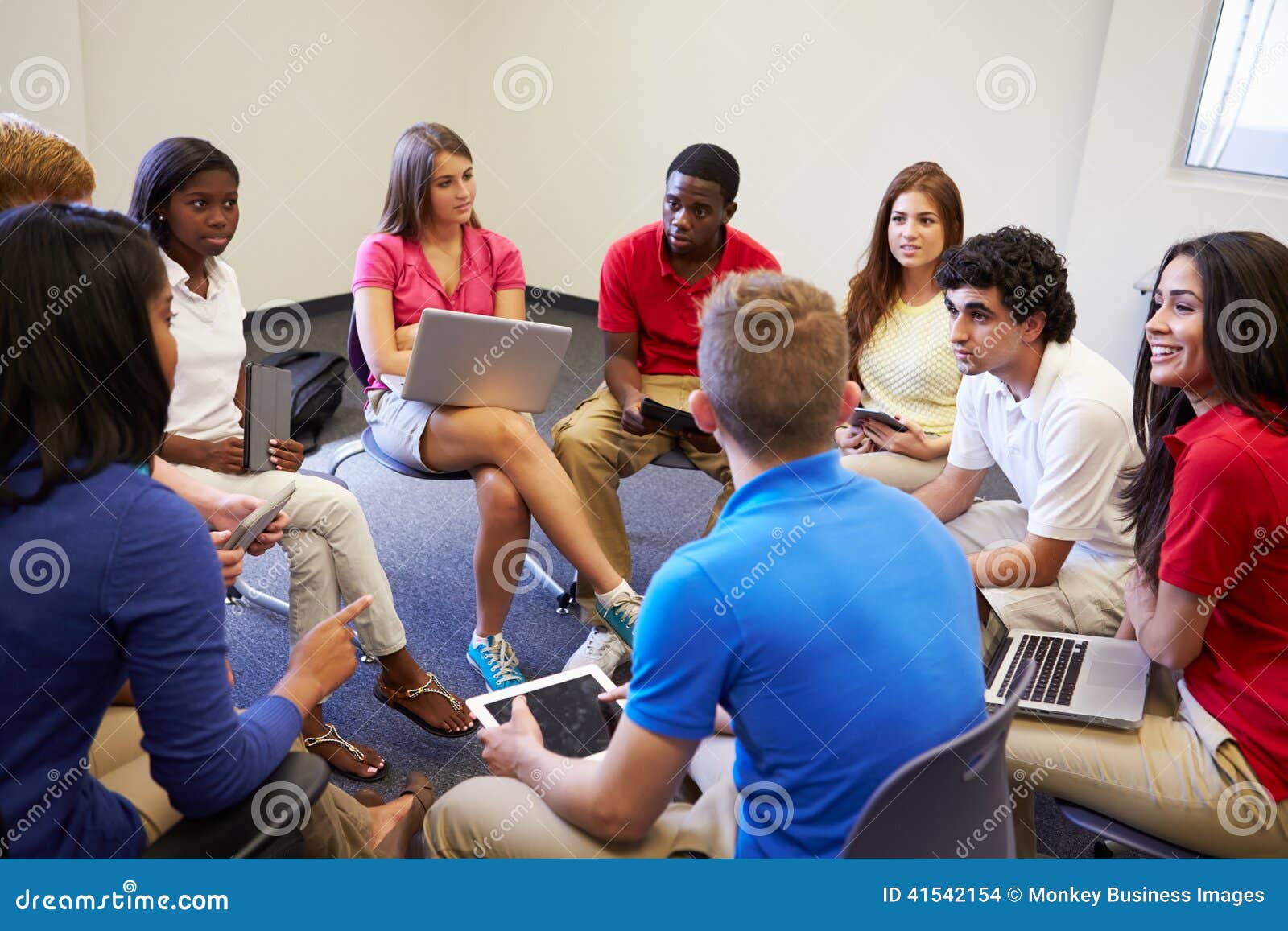 high school students taking part in group discussi