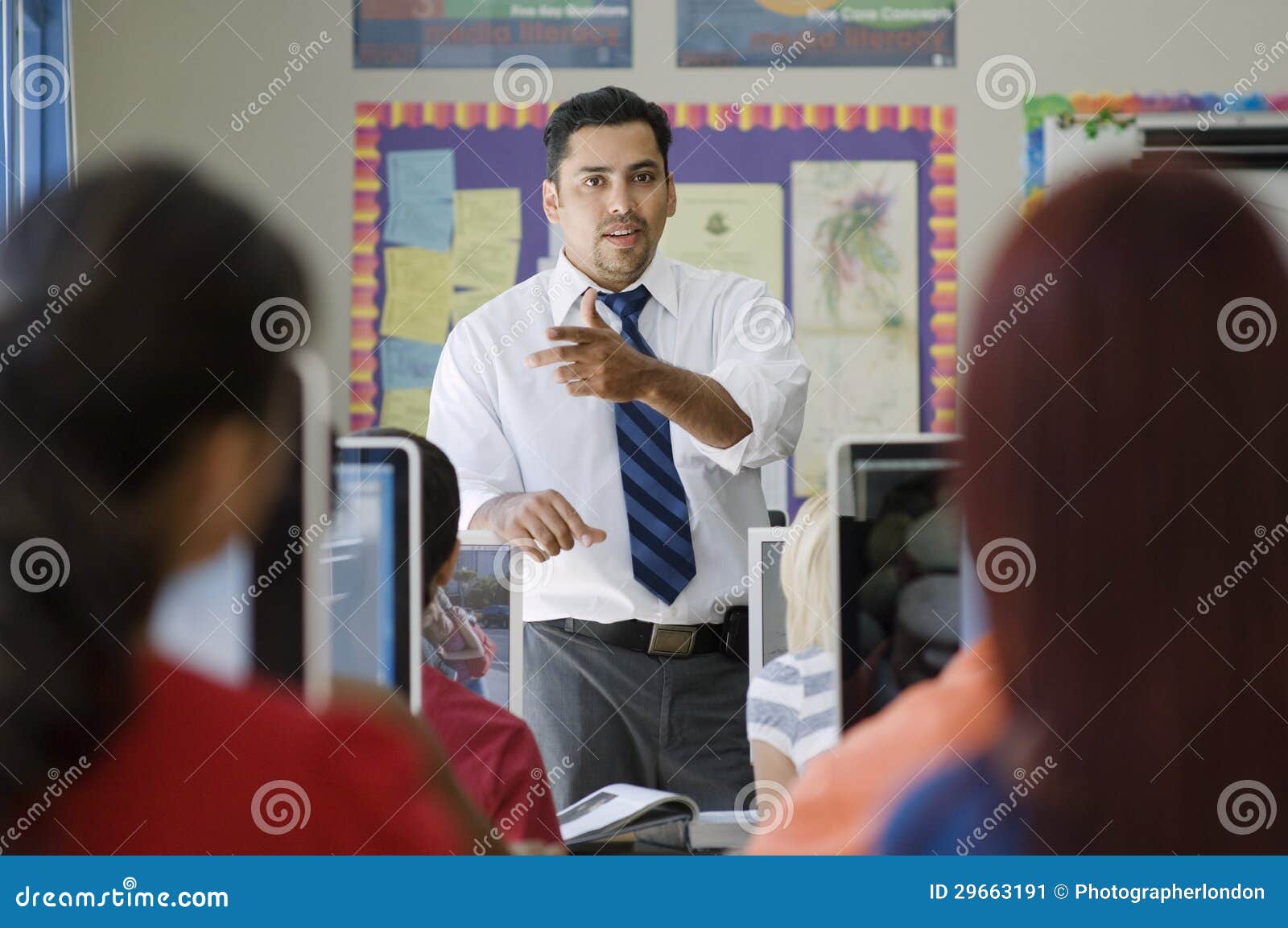 high school teacher teaching in class