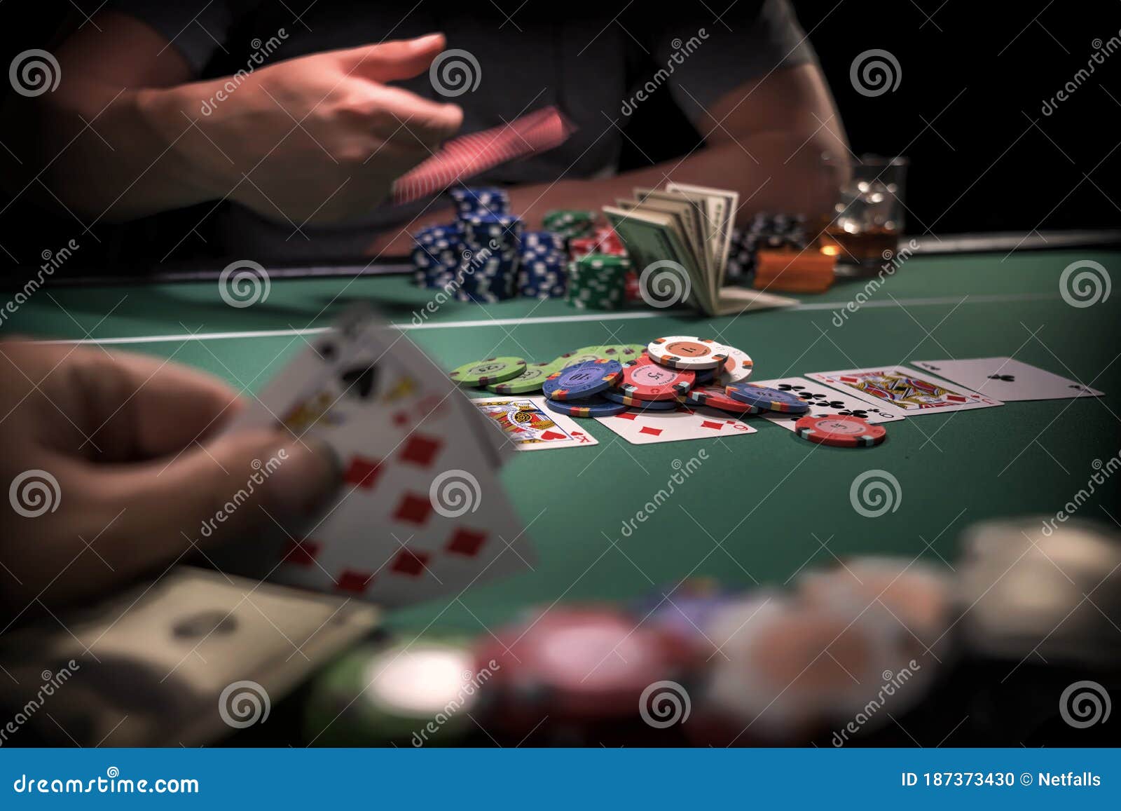 high-stakes-poker-game-casino-187373430.jpg