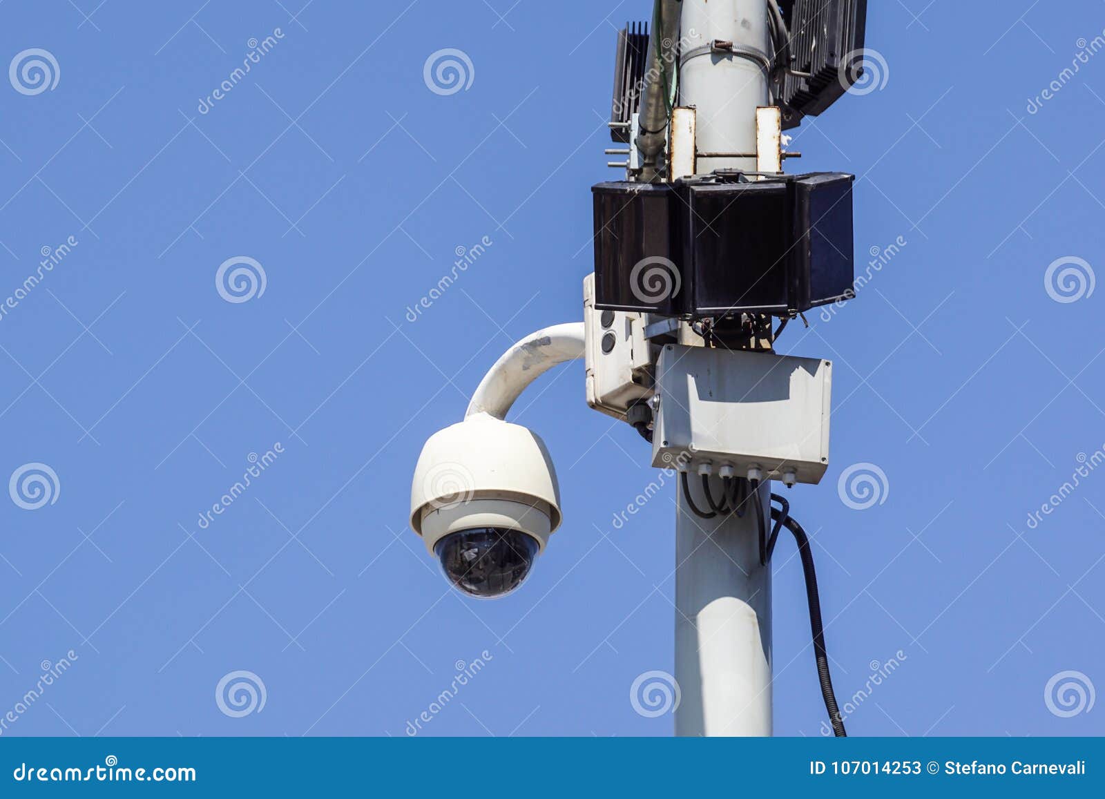 High Tech Overhead Security Camera with a Blue Sky Stock Image Image