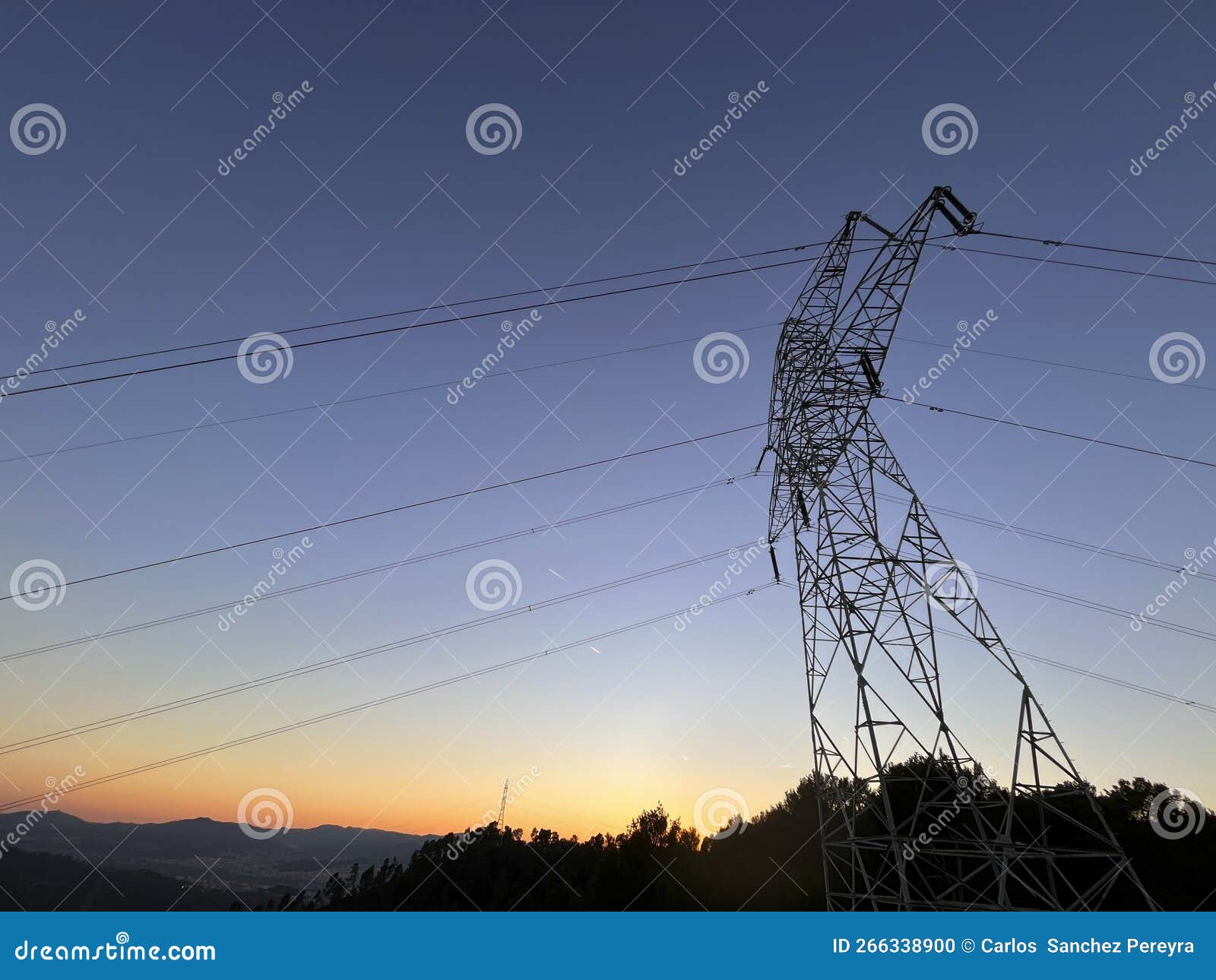 High Voltage Cable Tower during Sunset on a Mountain Stock Photo