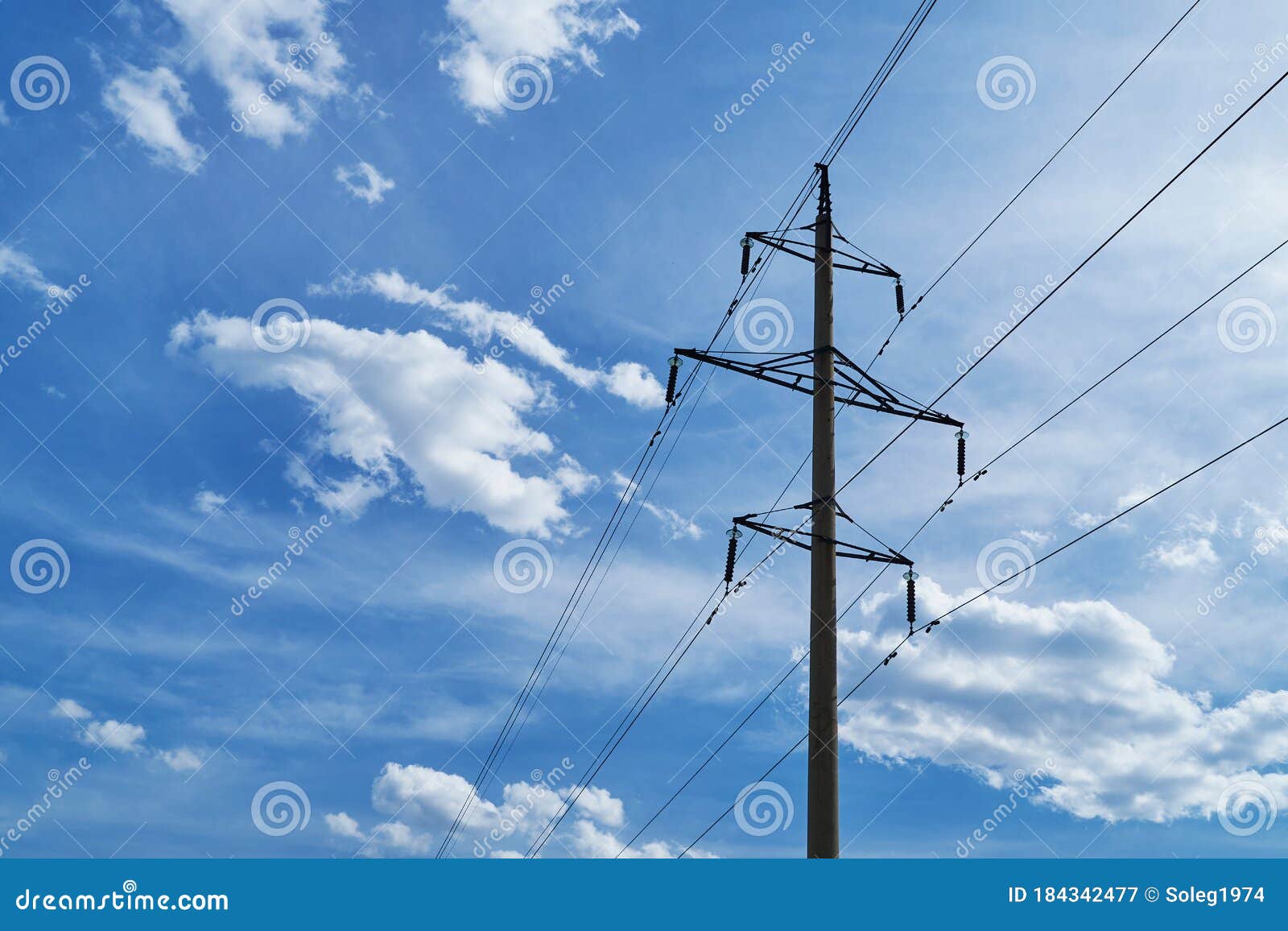 Highvoltage Electric Line Against a Bright Beautiful Sky Stock Image