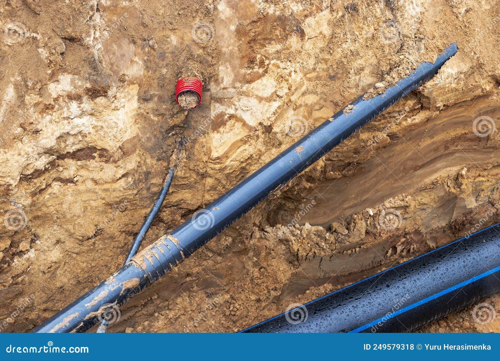 The High Voltage Electrical Cable is Laid in a Trench Under Existing