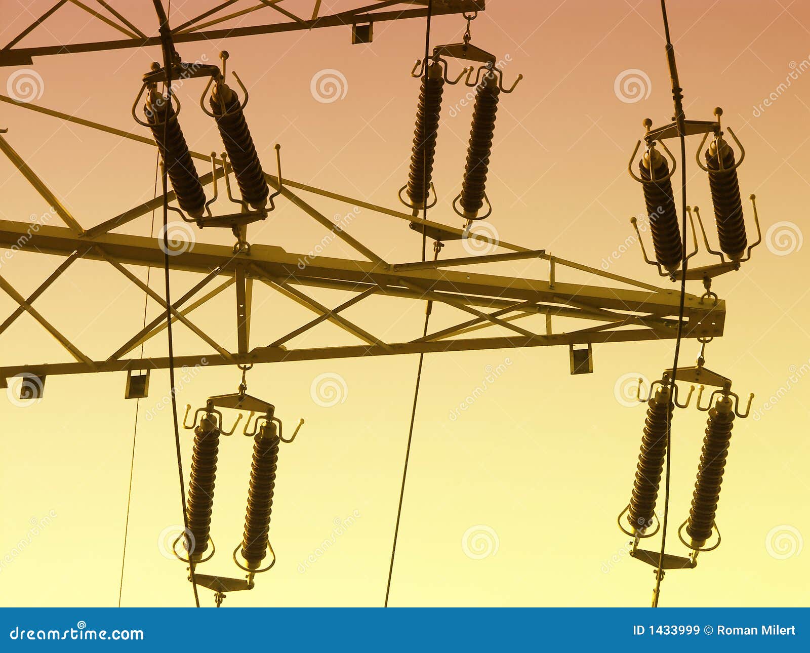 High voltage line. High voltage pylon with insulators over sunset sky