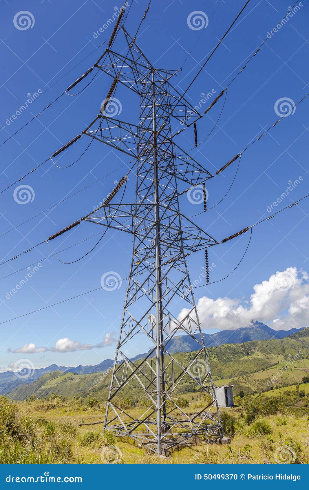 high voltage lines beneath the blue cloudy sky