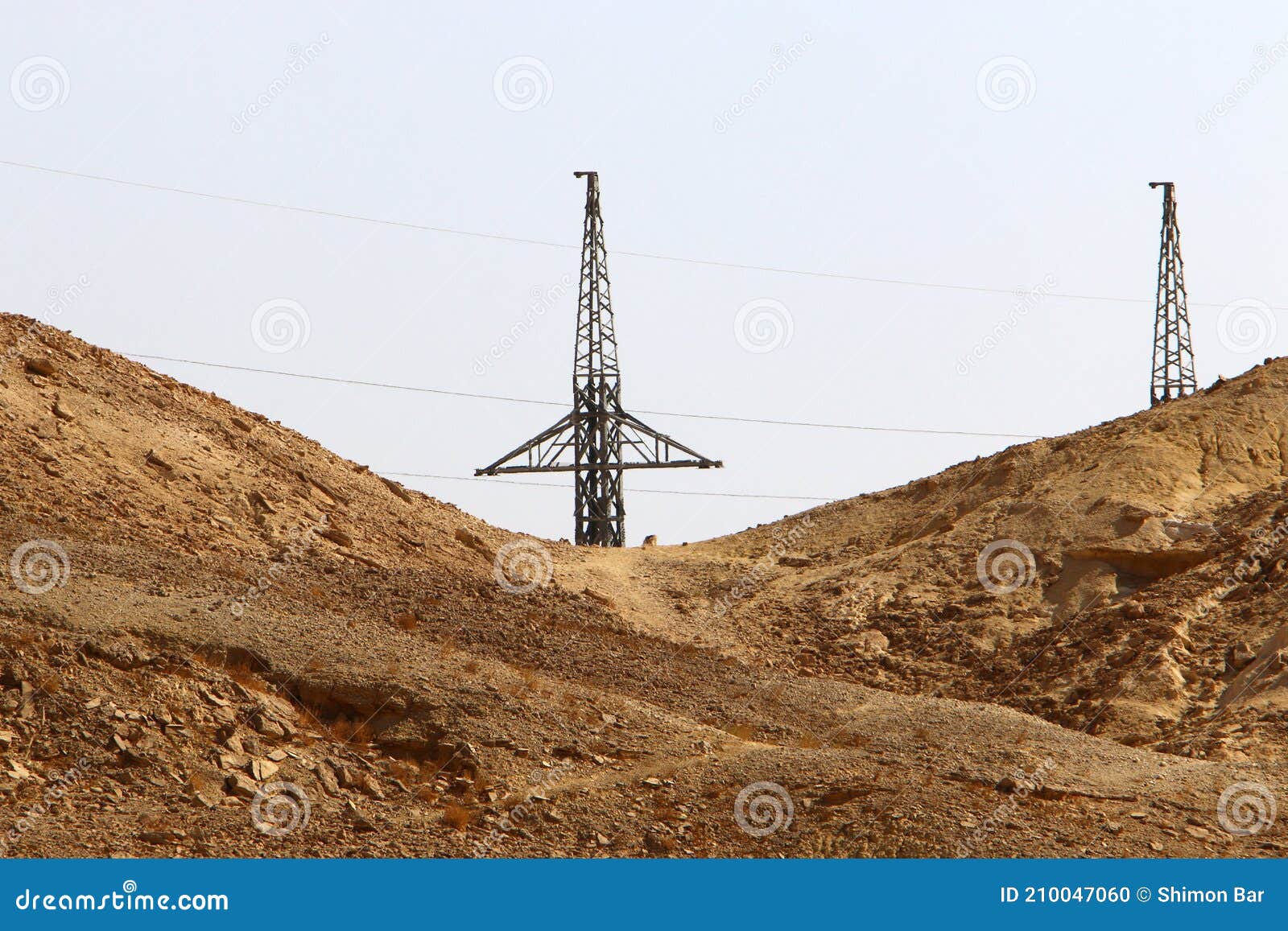 High Voltage Power Lines through Fields and Mountains in Israel Stock