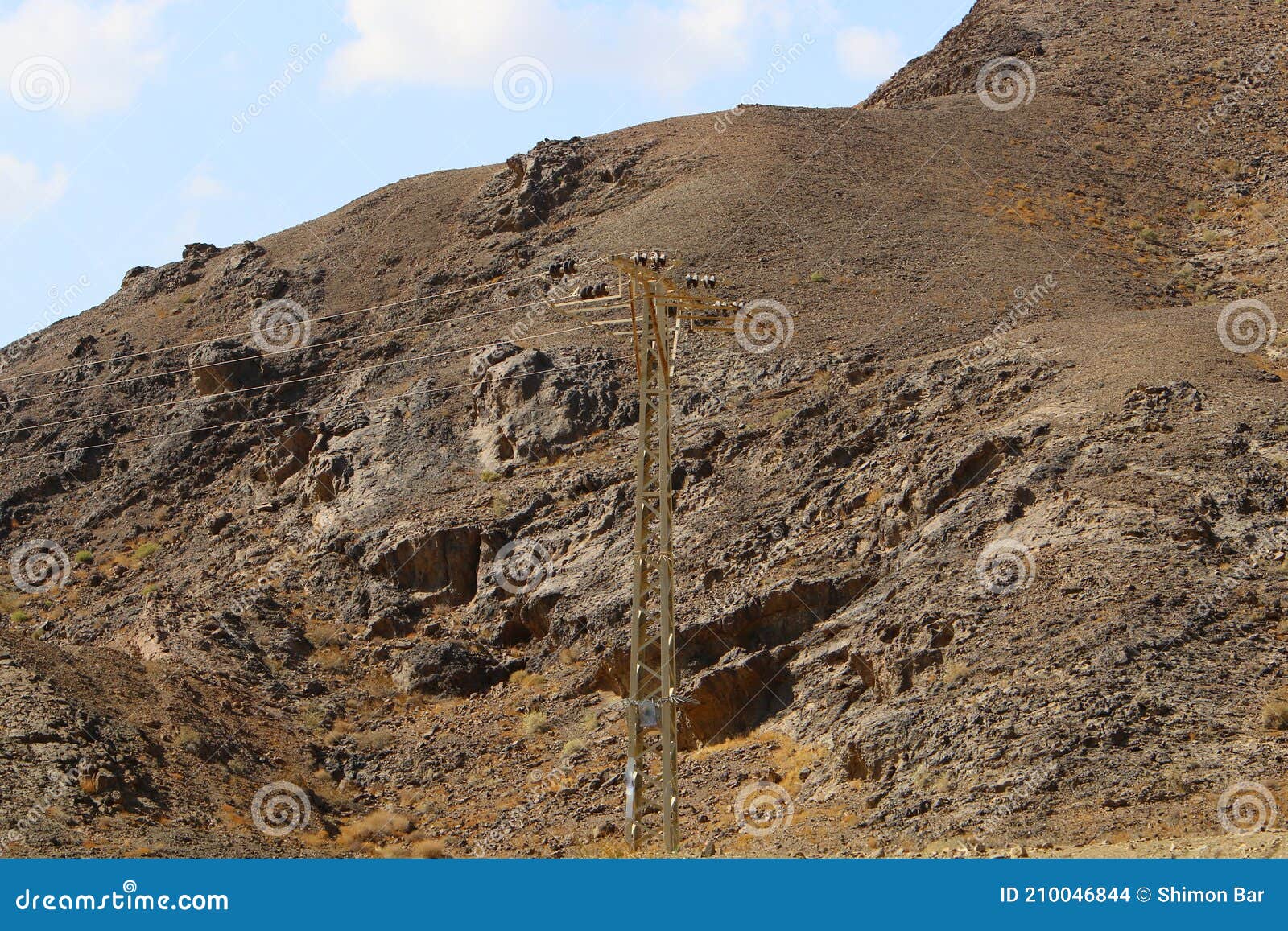 High Voltage Power Lines through Fields and Mountains in Israel Stock