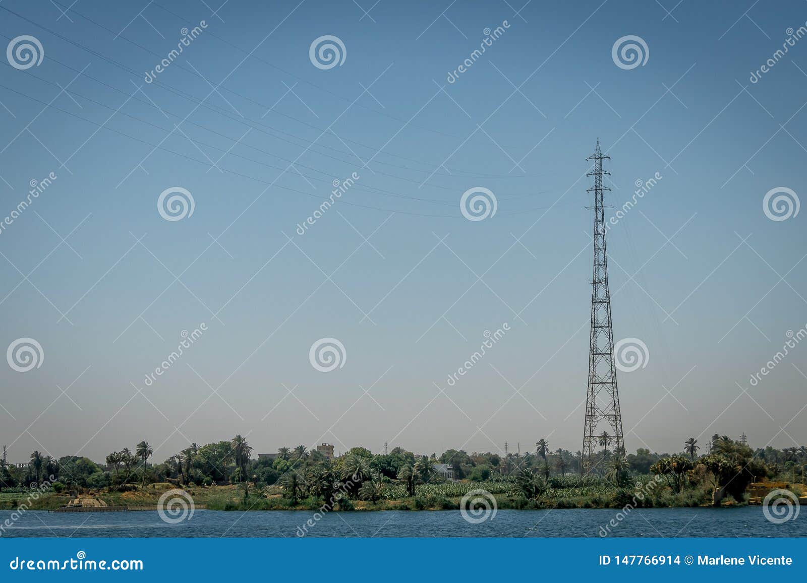 High Voltage Tower on the Bank of the Nile River. Egypt Stock Photo