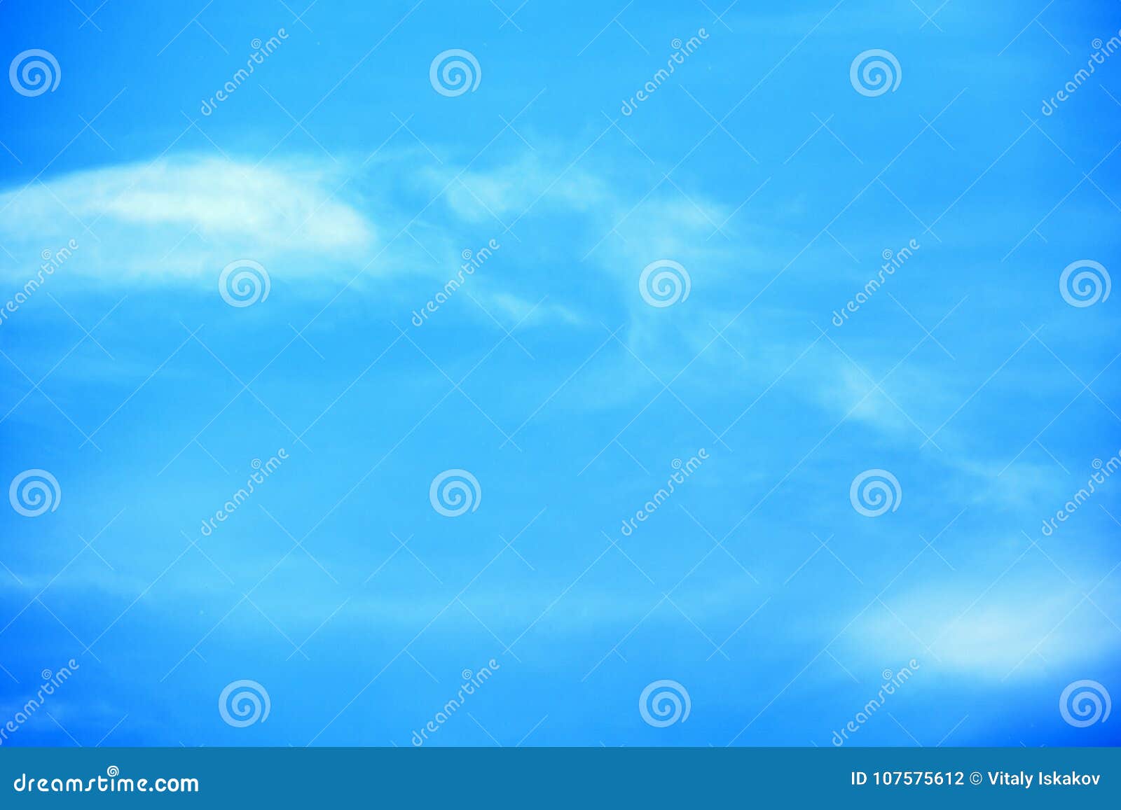 high white wispy cirrus clouds with cirro-stratus in the blue australian sky sometimes called mare`s tails indicate fine weather