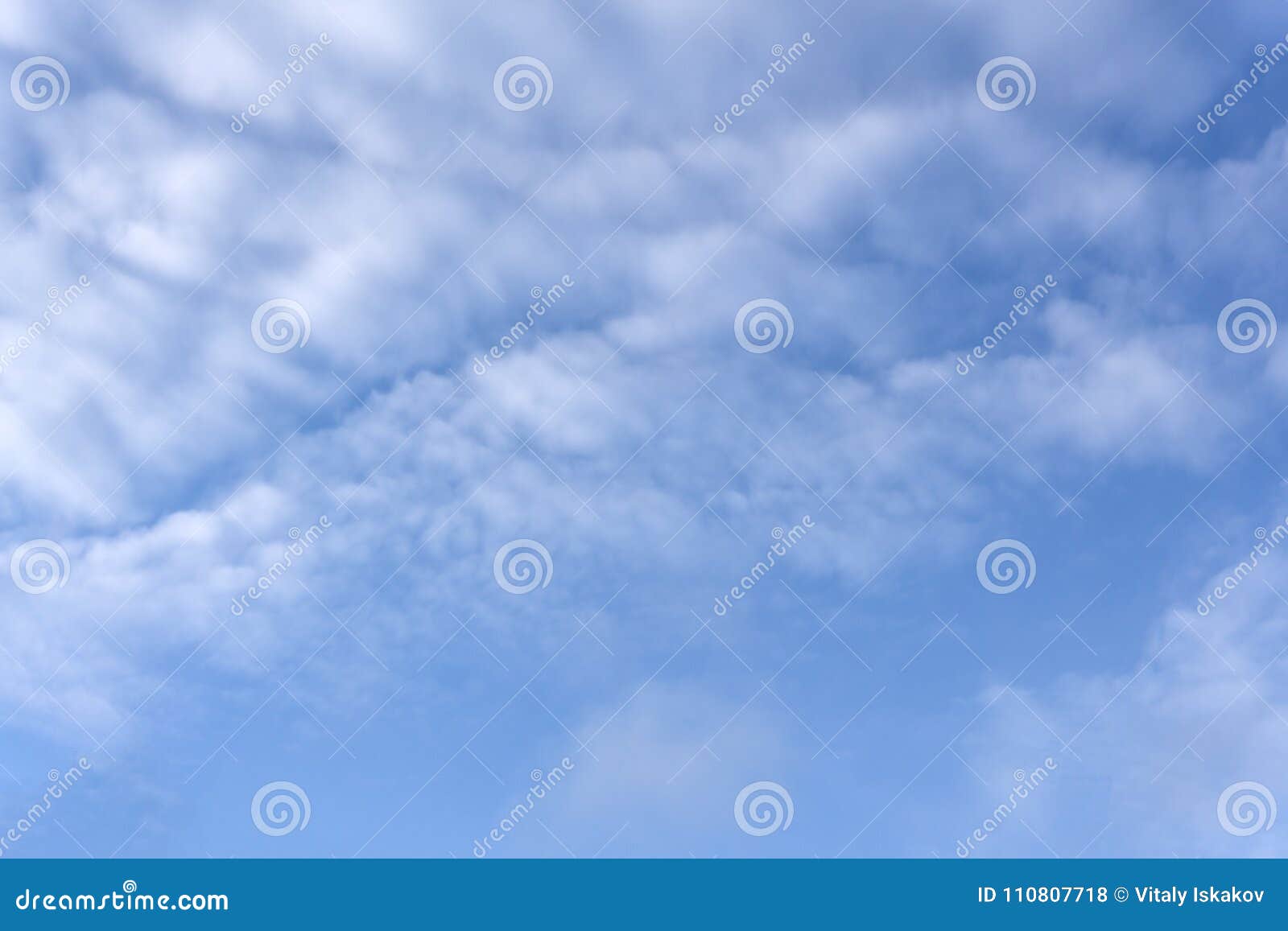 high white wispy cirrus clouds with cirro-stratus in the blue australian sky sometimes called mare`s tails indicate fine weather