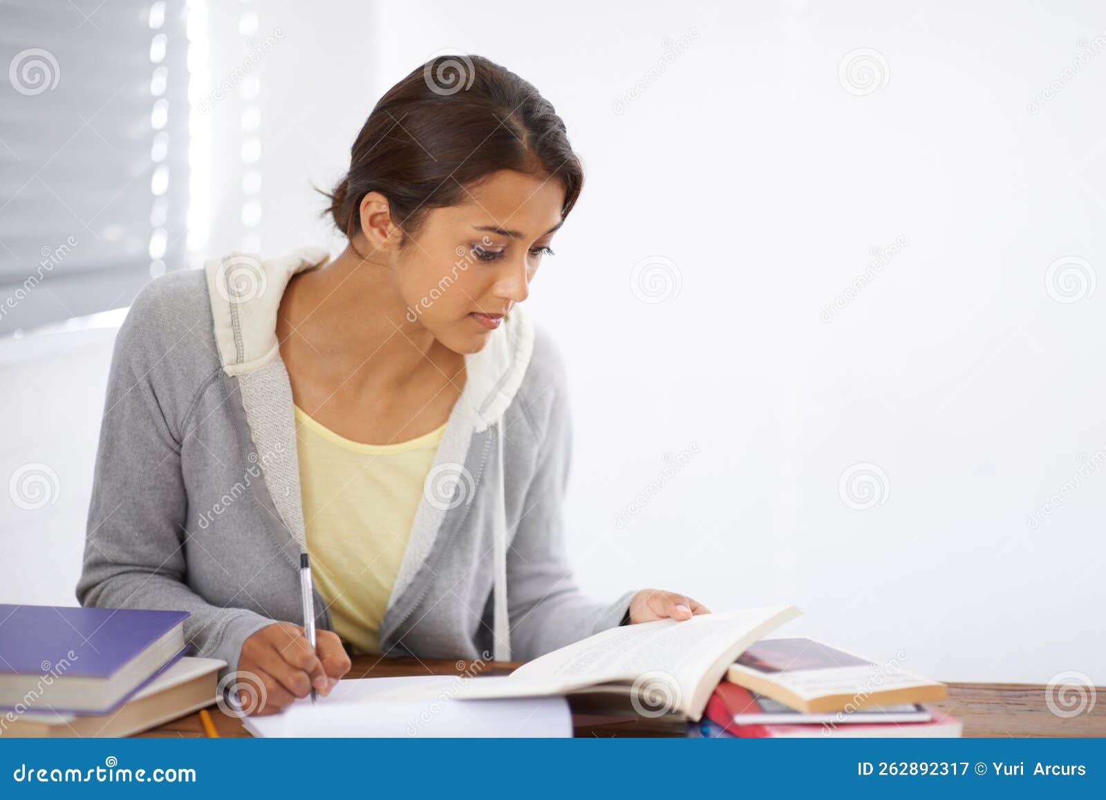 Highlighting the Key Points. a Pretty College Student Taking Notes from