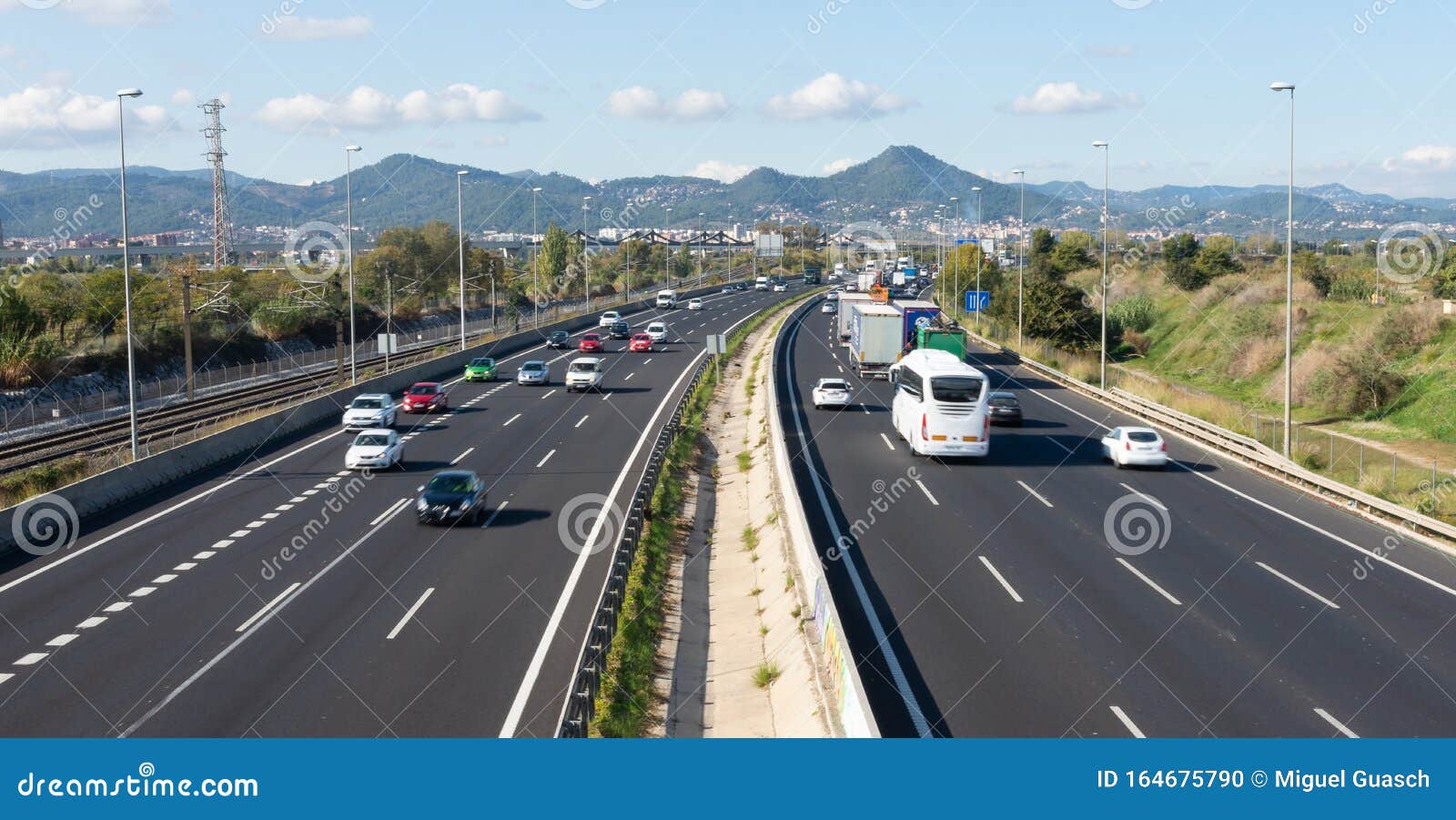 Highway in Rush Hour with Vehicles in Both Directions Stock Photo