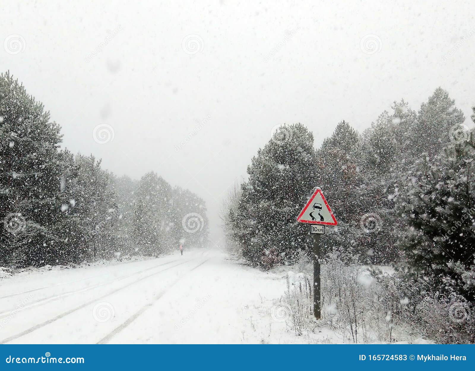 highway snow road - sudden and heavy snowfall on a thoroughfare driving on it becomes dangerous