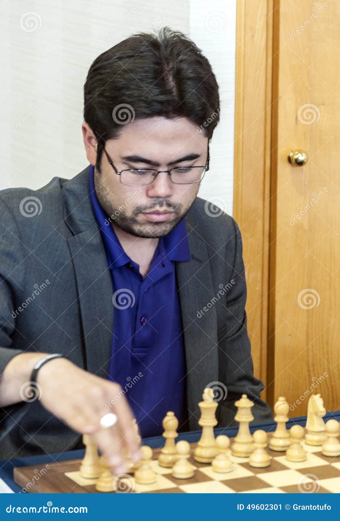 Man playing chess against computer - Stock Image - Everypixel