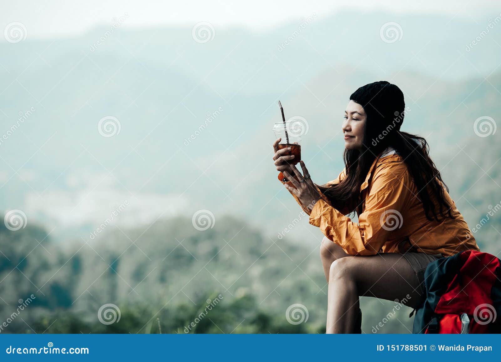 hiker asian woman sitting and drinking coffee for relax and rest on mountain. female adventure backpack and trips camping on hike
