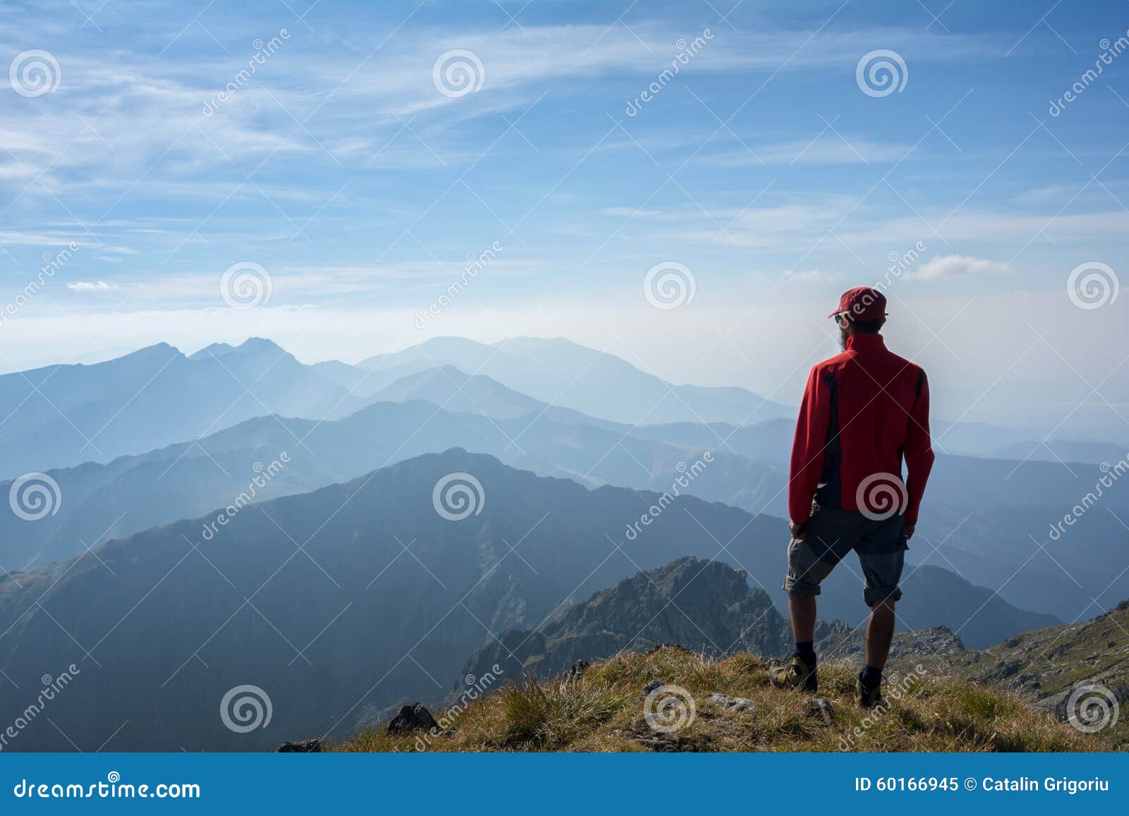 hiker looking over the mountain ridges