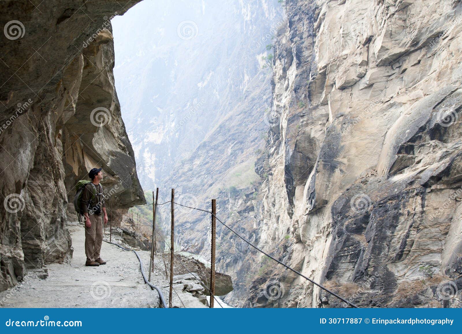 hiker on steep mountain path