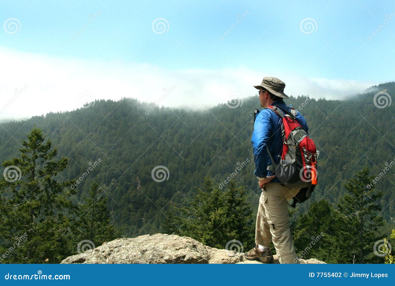 hiker on top of a peak