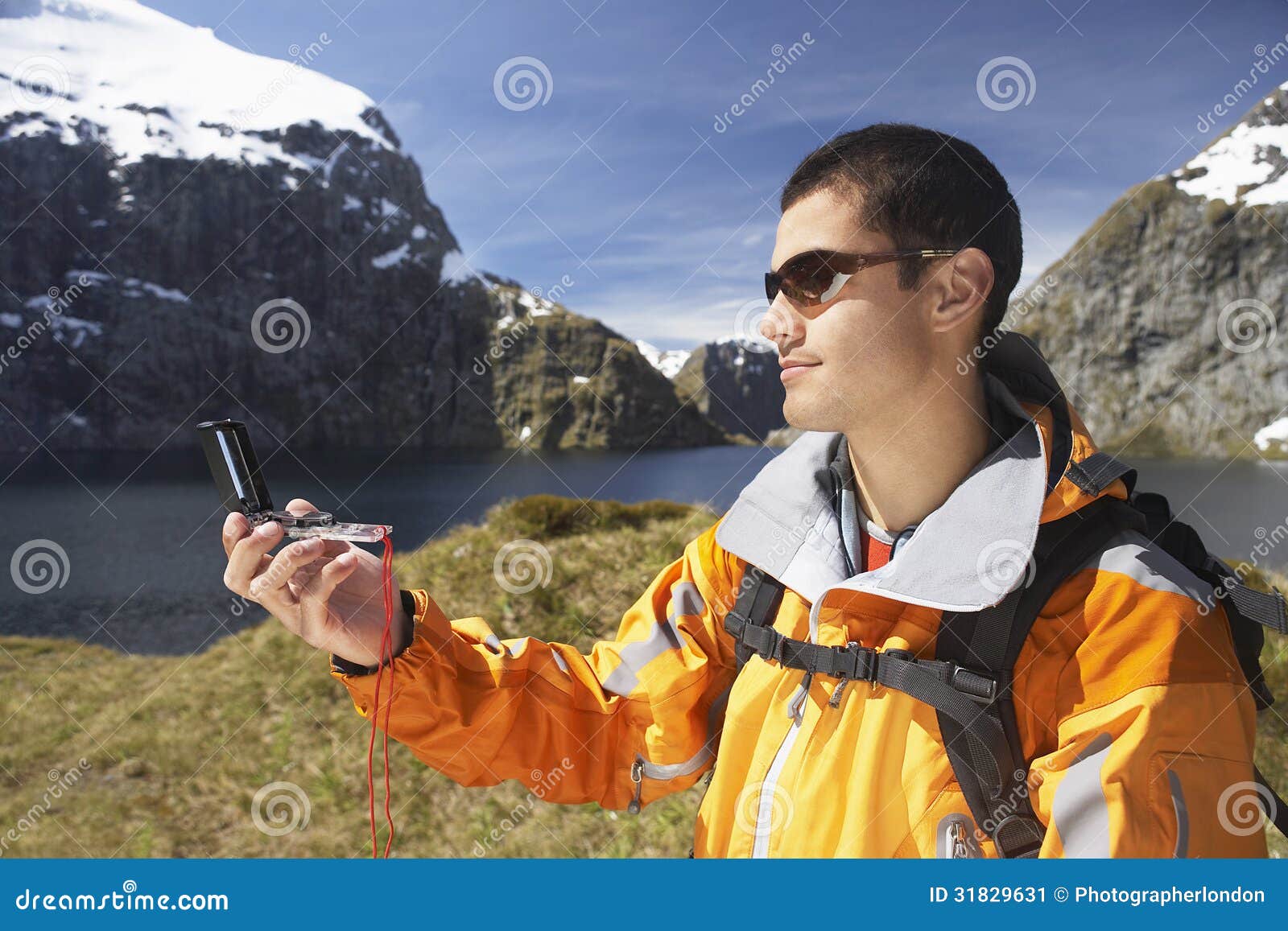 Hiker Using Compass by Mountain Lake Stock Image Image of hiker