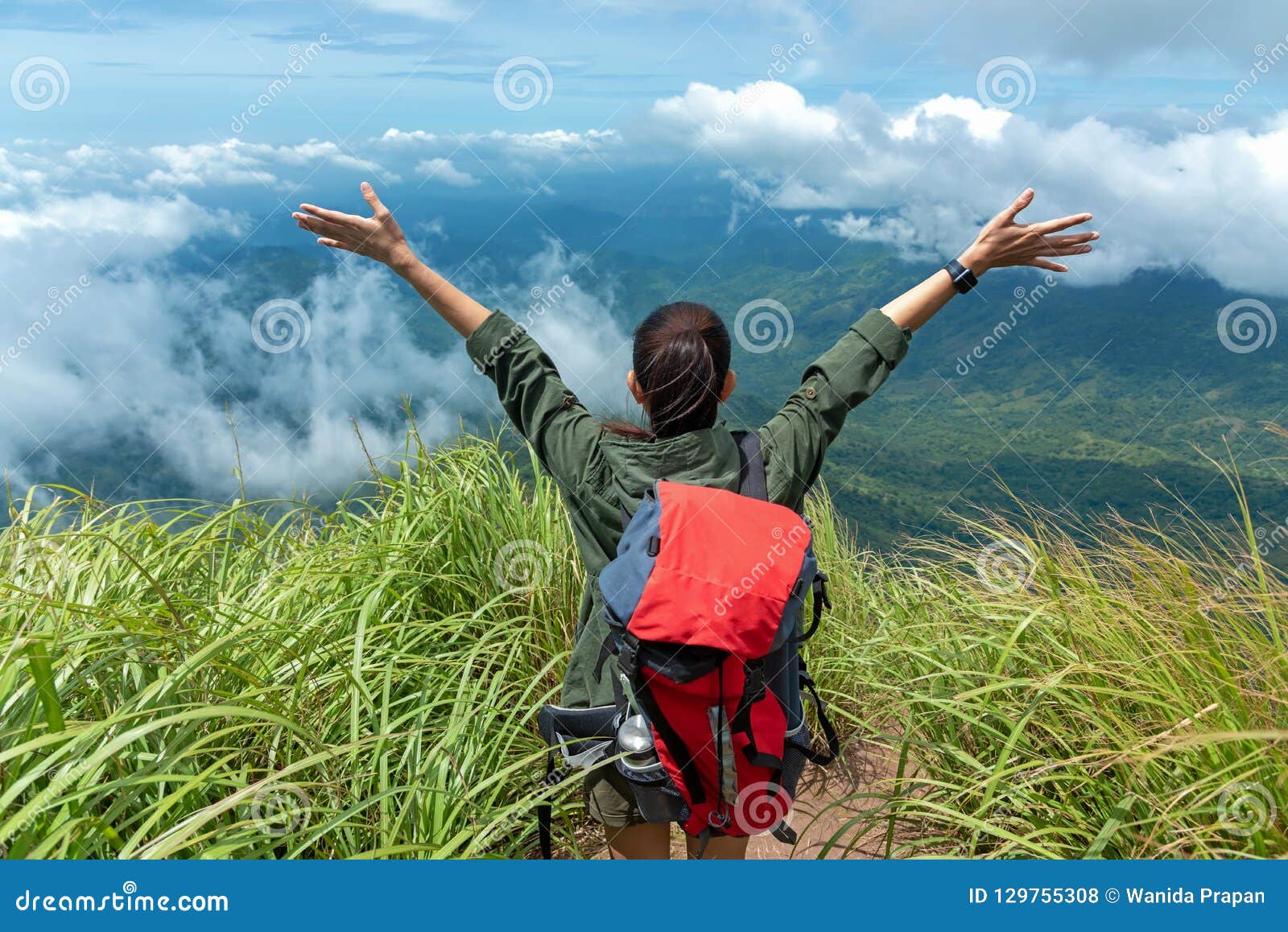 hiker woman happy feeling freedom good and strong weight victorious facing on the natural mountain.