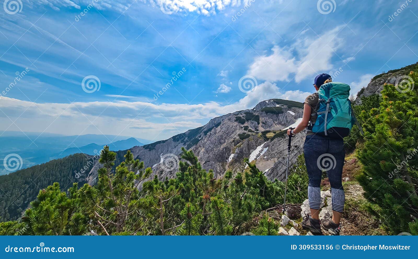 petzen - hiker woman looking at alpine valley on way to mountain peaks feistritzer spitze (hochpetzen), karawanks