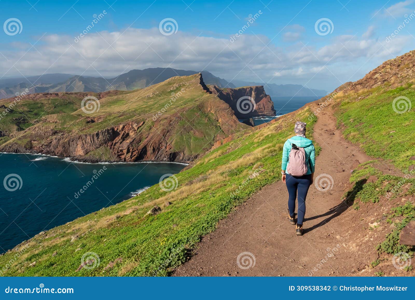 sao lourenco - hiker woman with panoramic view of majestic atlantic ocean coastline at ponta de sao lourenco peninsula, canical