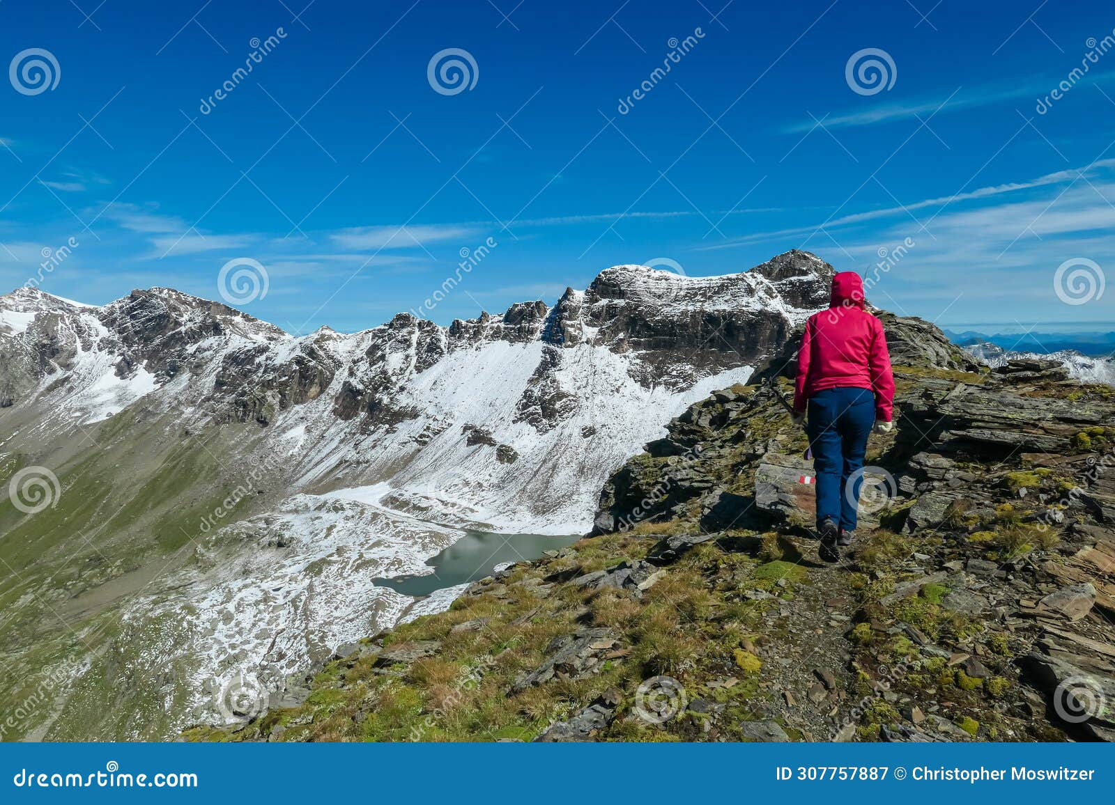 feldseekopf - hiker woman with scenic view of majestic mountain peaks of high tauern, carinthia salzburg, austria.