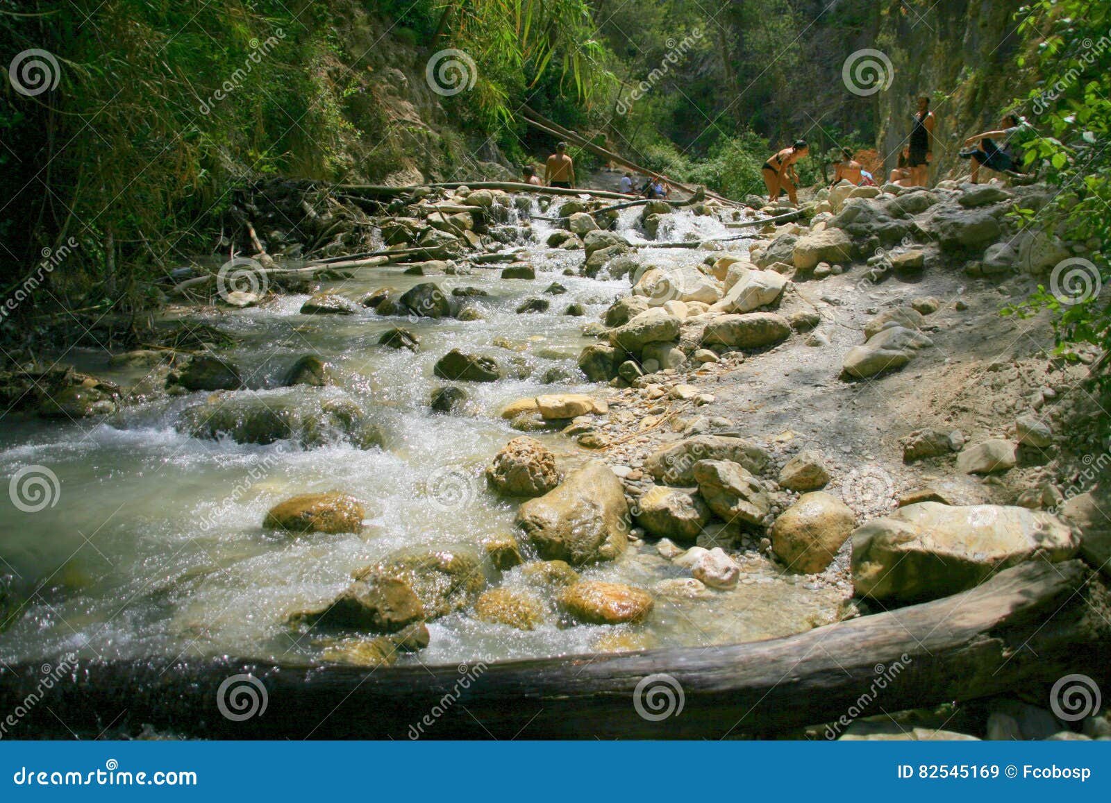 hikers in the chillar river, nerja, malaga