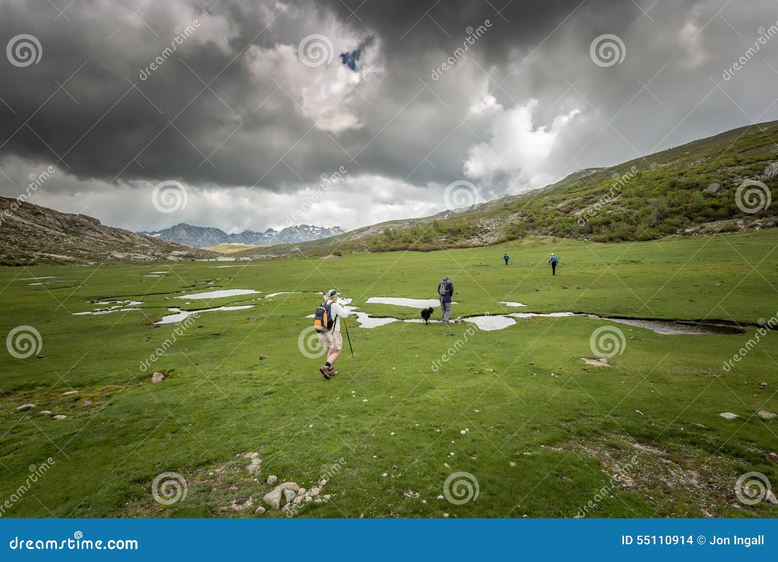 hikers near lac de nino in corsica