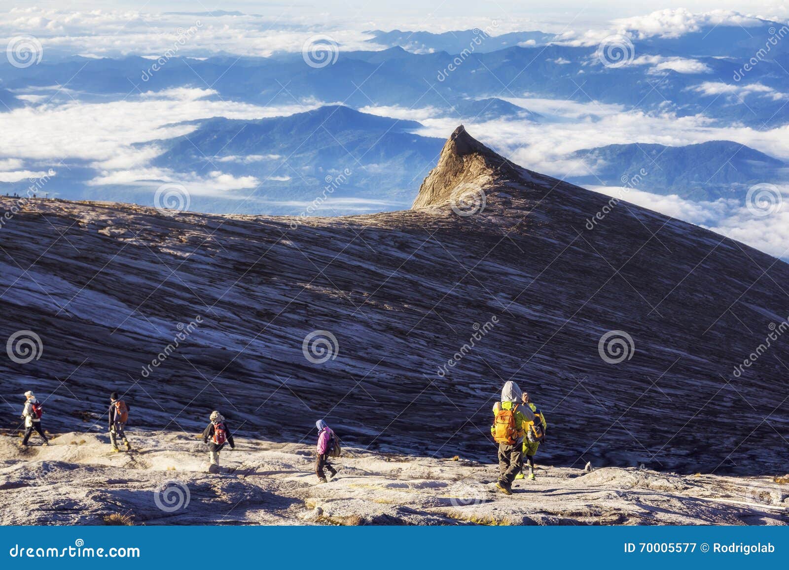 hikers at the top of mount kinabalu in sabah, malaysia