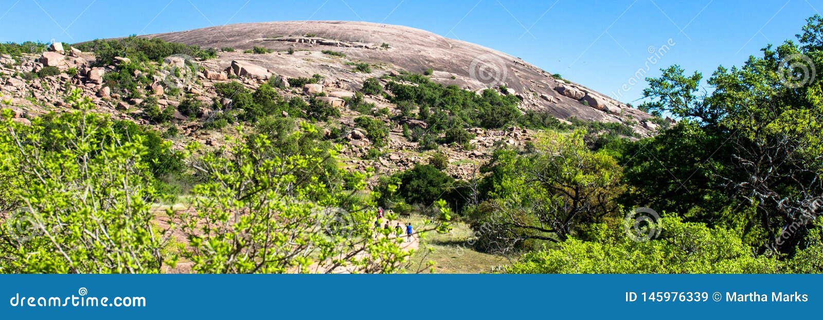 hikers at enchanted rock state natural area in texas