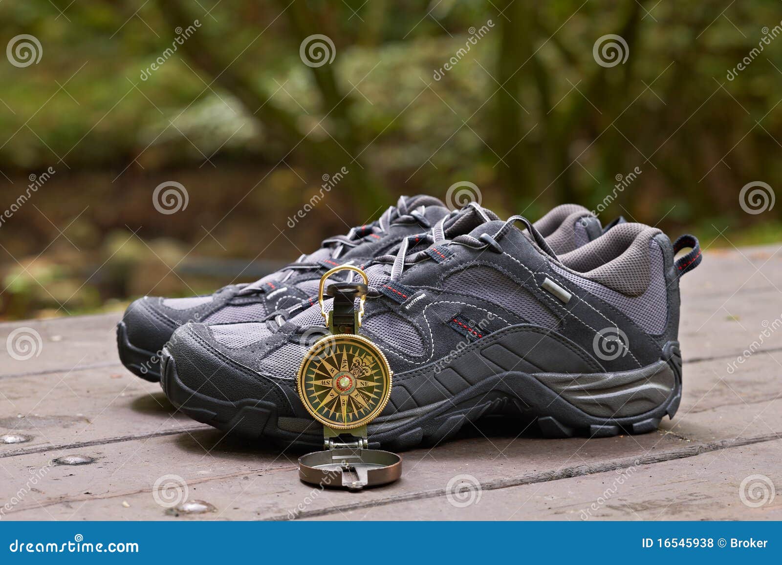 Hiking boots and compass stock photo. Image of boots 16545938